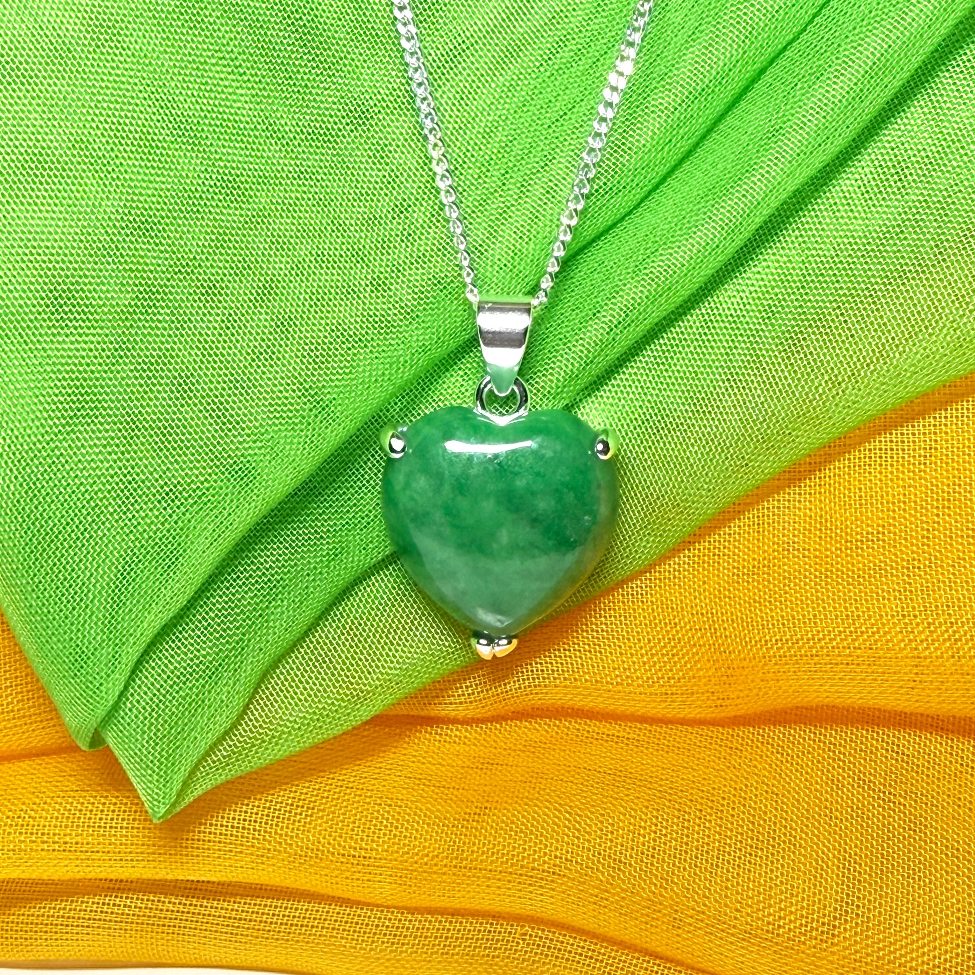 A beautiful real green jade necklace heart shape sterling silver pendant