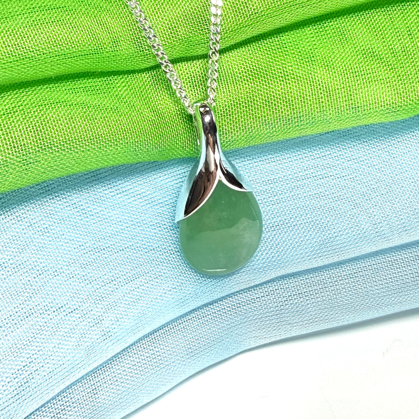 A beautiful real green jade necklace in a teardrop or pear shape, a really stunning designed pendant
