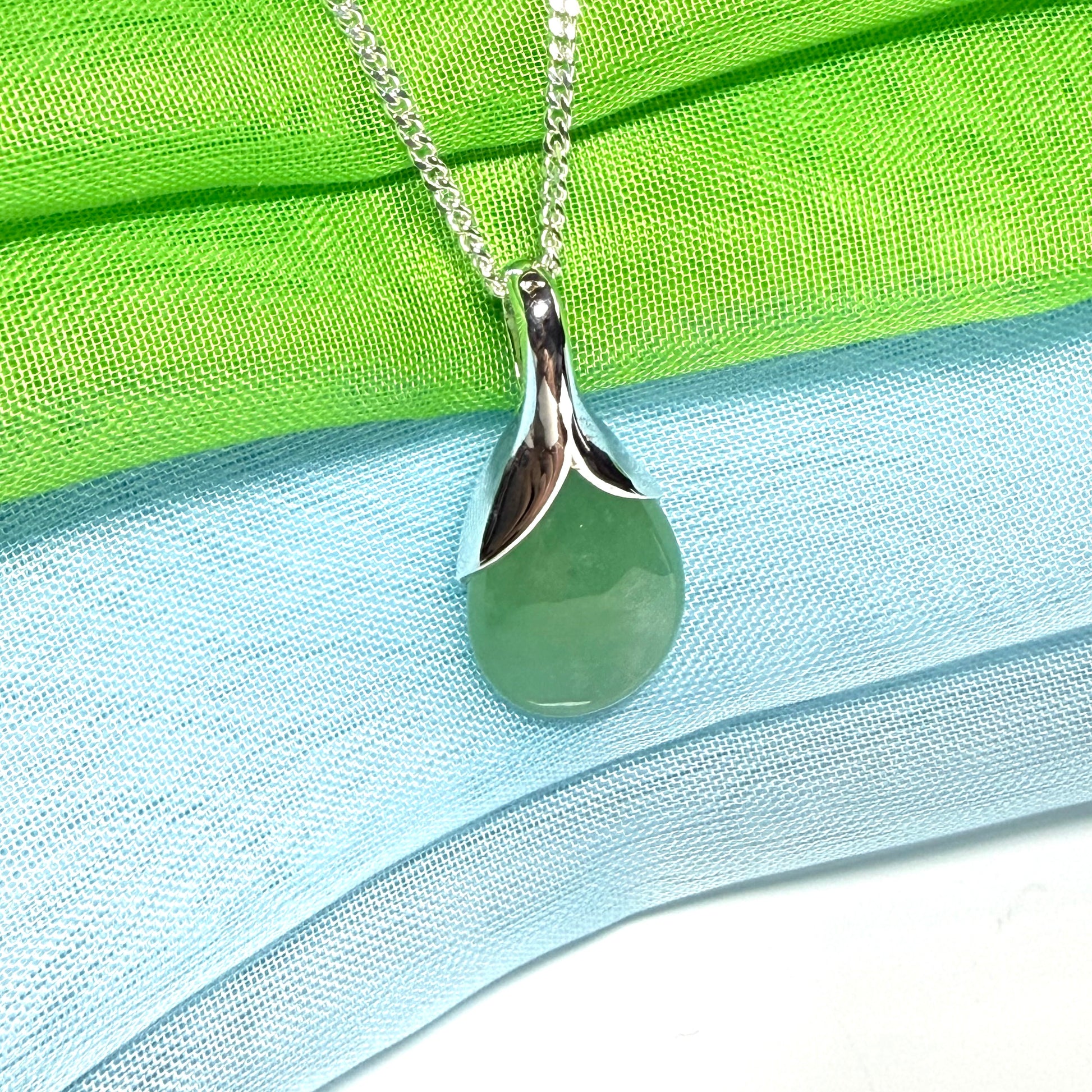 A beautiful real green jade necklace in a teardrop or pear shape, a really stunning designed pendant