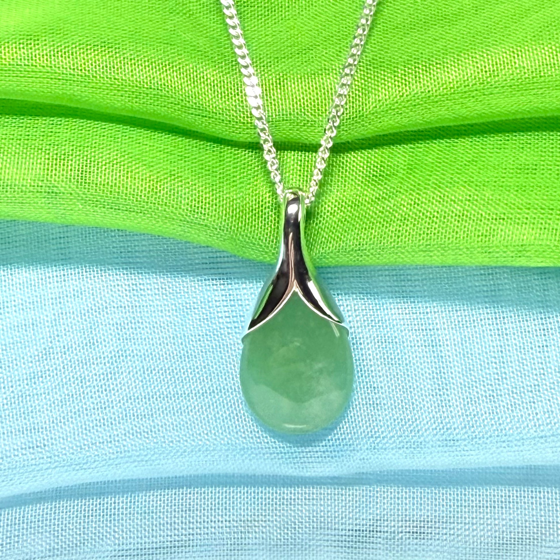 A beautiful real green jade necklace in a teardrop or pear shape, a really stunning designed pendant