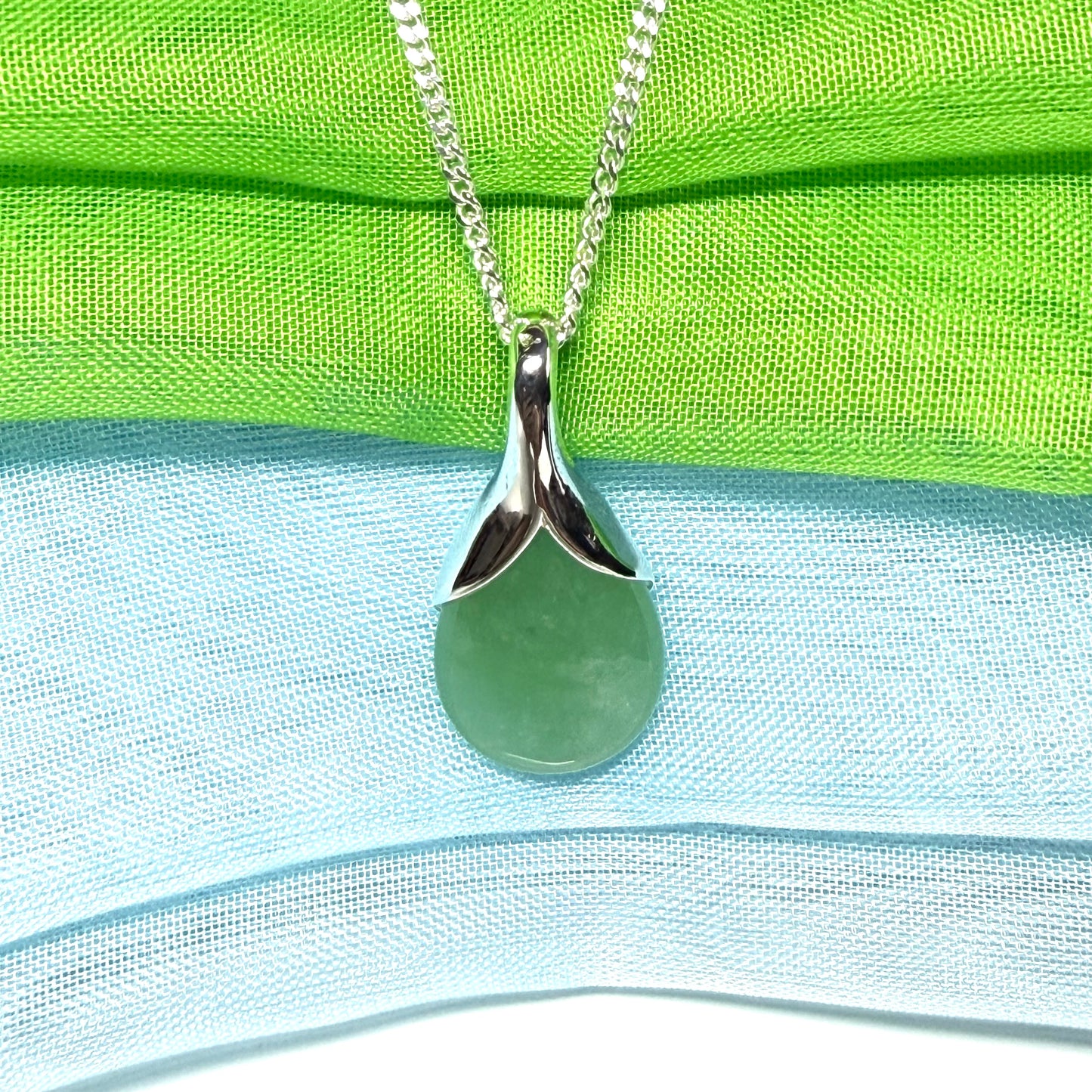 A beautiful real green jade necklace in a teardrop or pear shape, a really stunning designed pendant