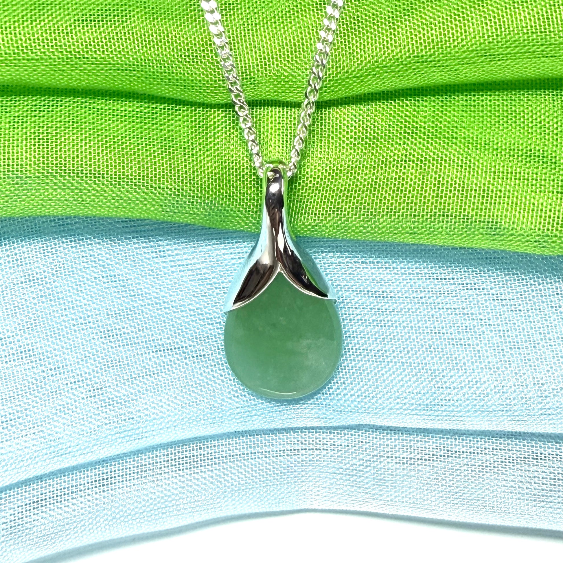 A beautiful real green jade necklace in a teardrop or pear shape, a really stunning designed pendant
