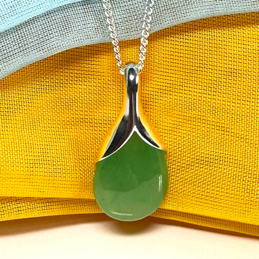 A beautiful real green jade necklace in a teardrop or pear shape, a stunning designed pendant