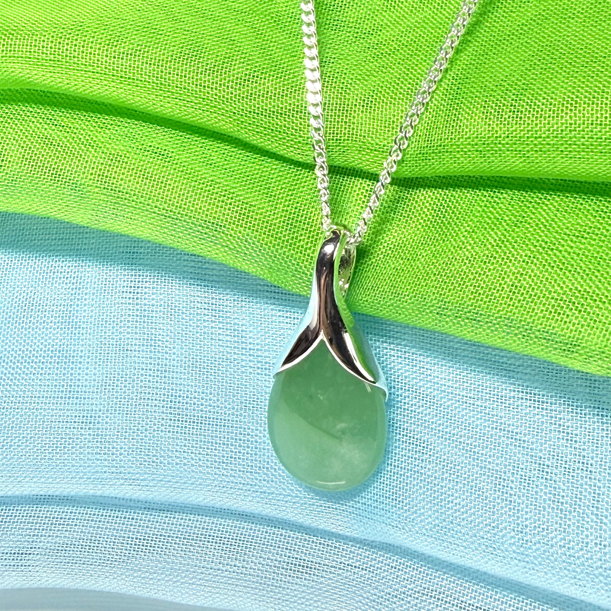 A beautiful real green jade necklace in a teardrop or pear shape, a really stunning designed pendant