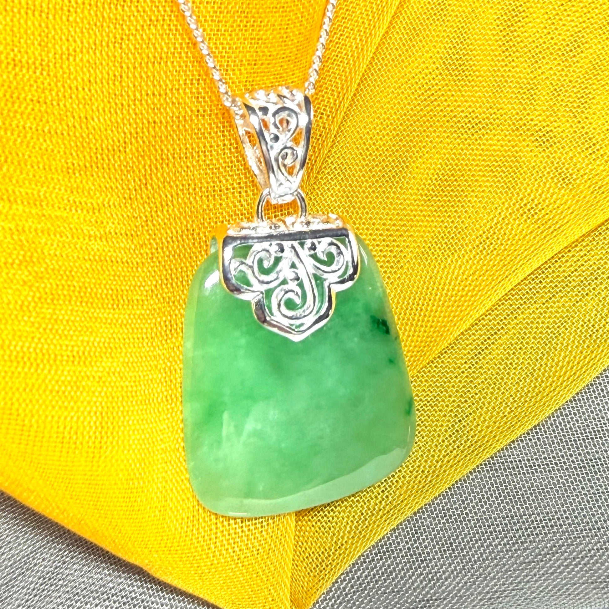 A beautiful real green jade necklace large pendant that is cushion in shape, stunning and irresistible