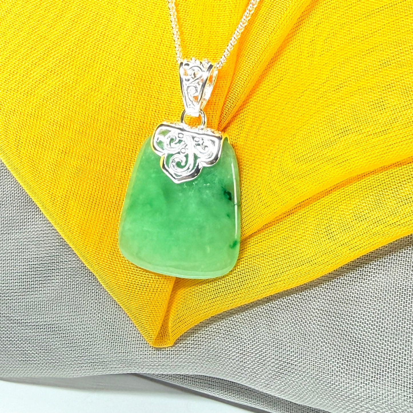 A beautiful real green jade necklace large pendant that is cushion in shape, stunning and irresistible