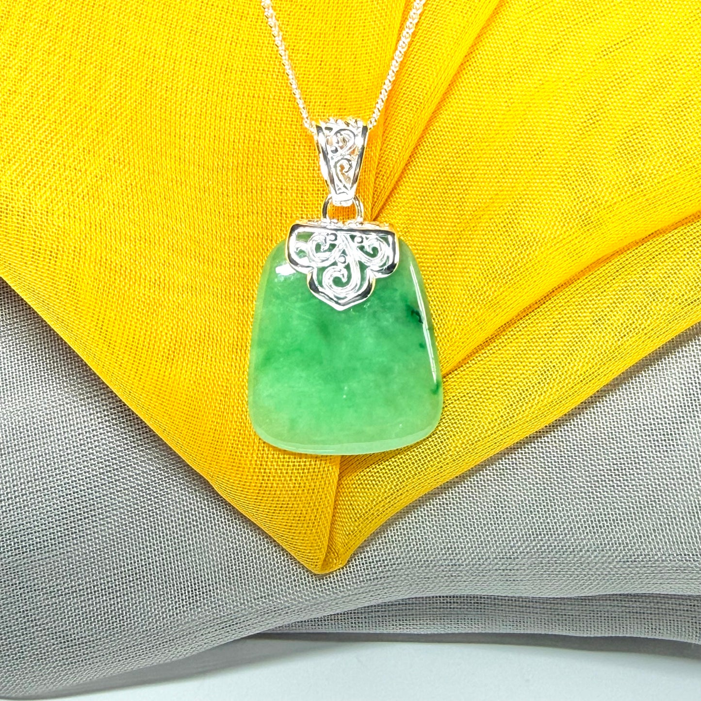 A beautiful real green jade necklace large pendant that is cushion in shape, stunning and irresistible