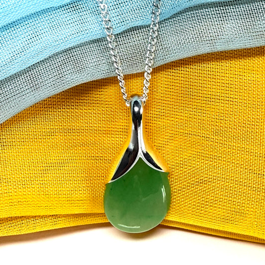 A beautiful real green jade necklace in a teardrop or pear shape, a stunning designed pendant