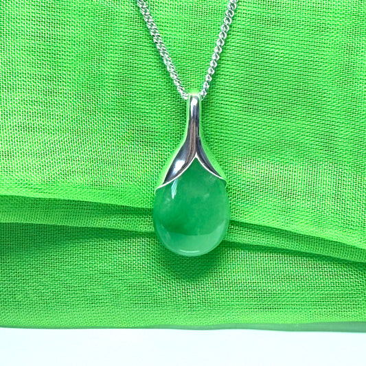 A beautiful real green jade necklace teardrop pendant pear shape with a solid chain