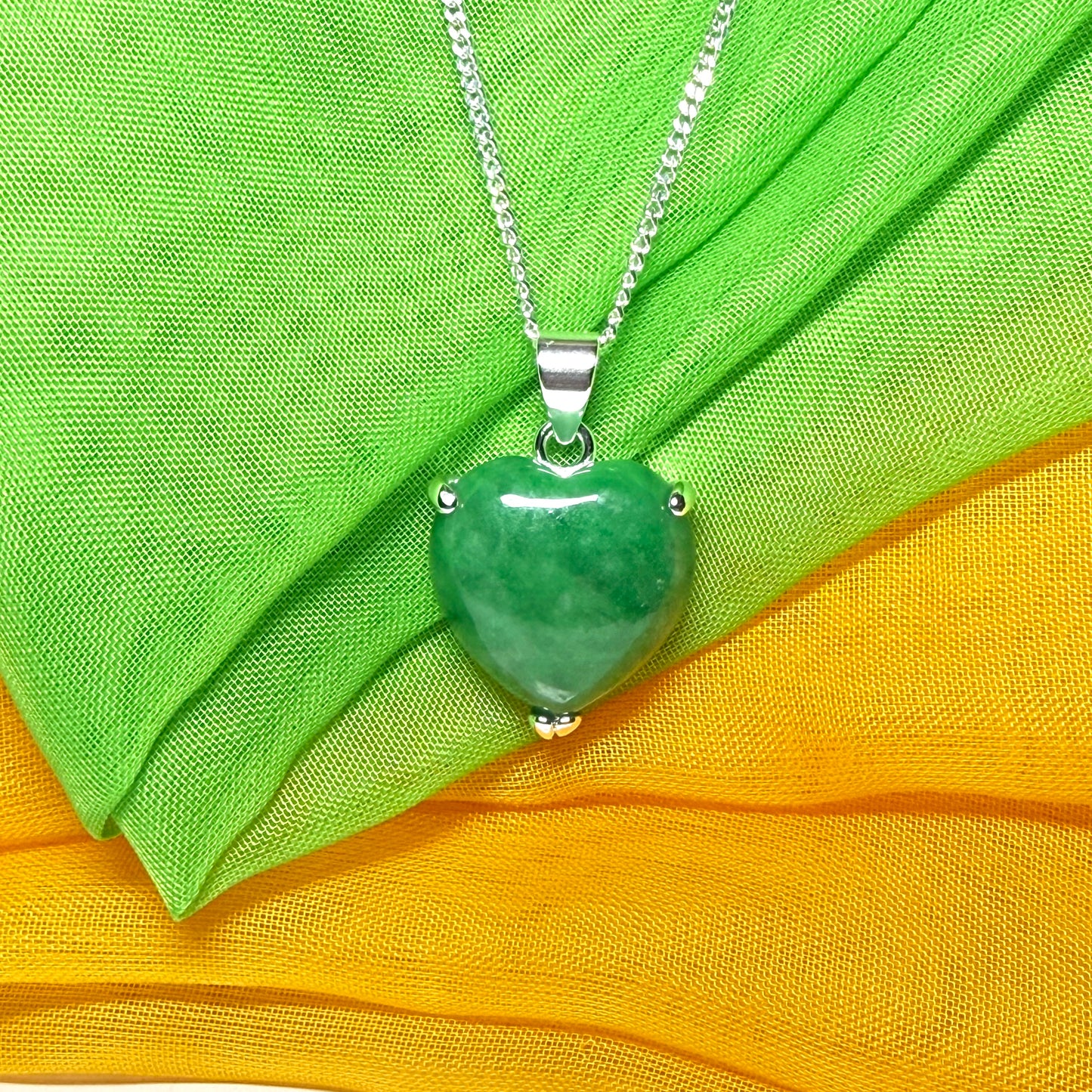 A beautiful real green jade necklace heart shape sterling silver pendant