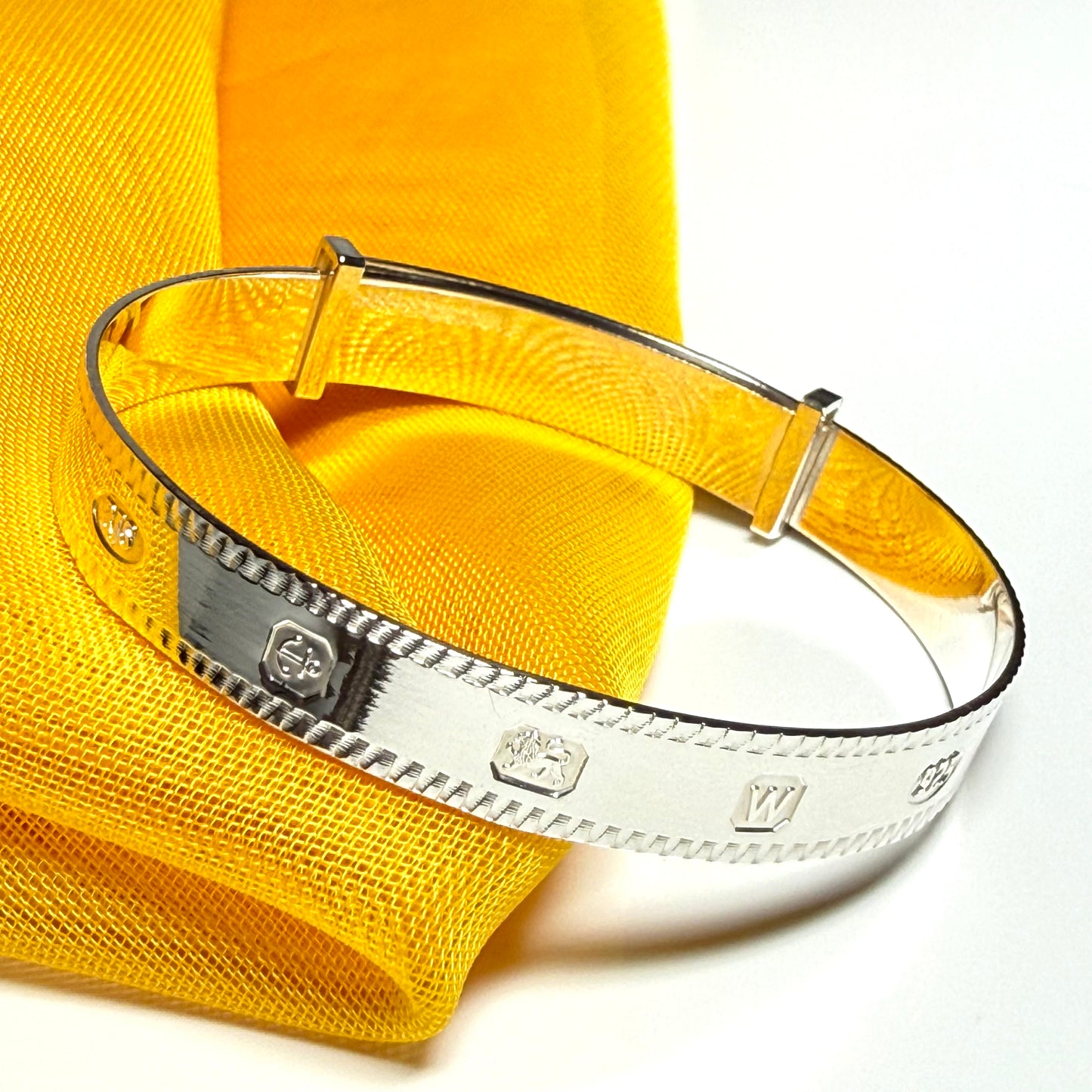 A child's small expanding bangle Hallmark feature designed sterling silver