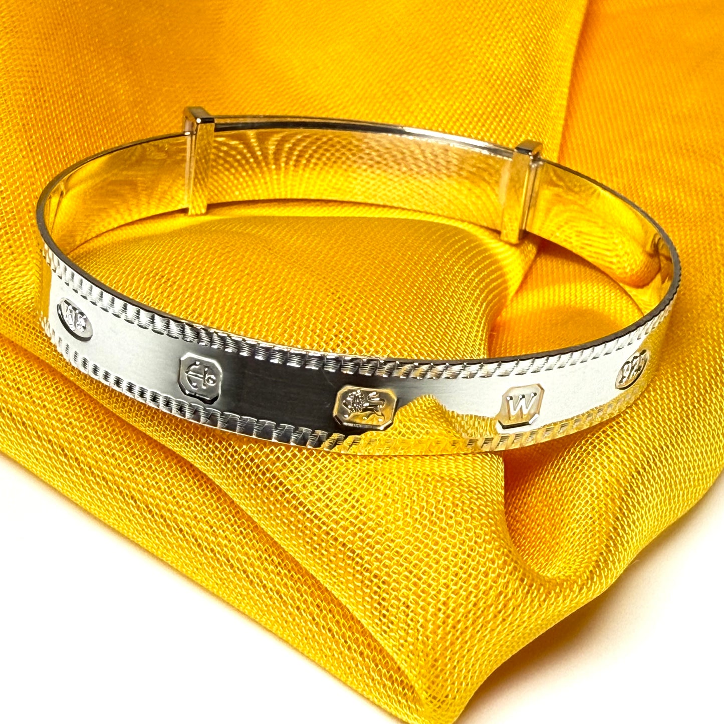 A child's small expanding bangle Hallmark feature designed sterling silver