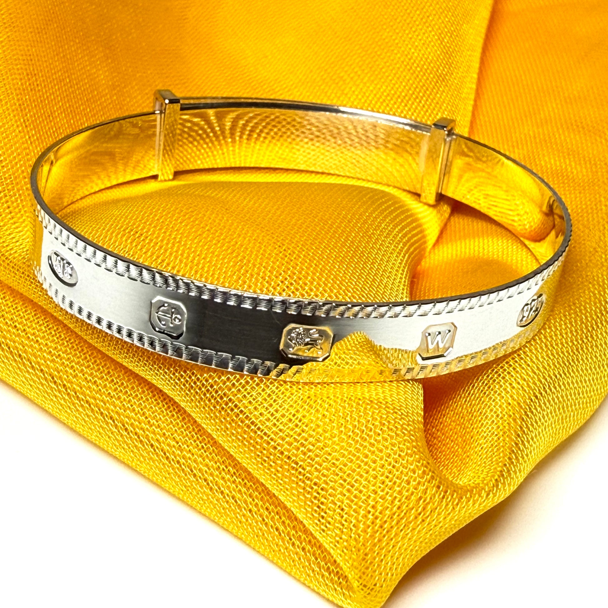 A child's small expanding bangle Hallmark feature designed sterling silver