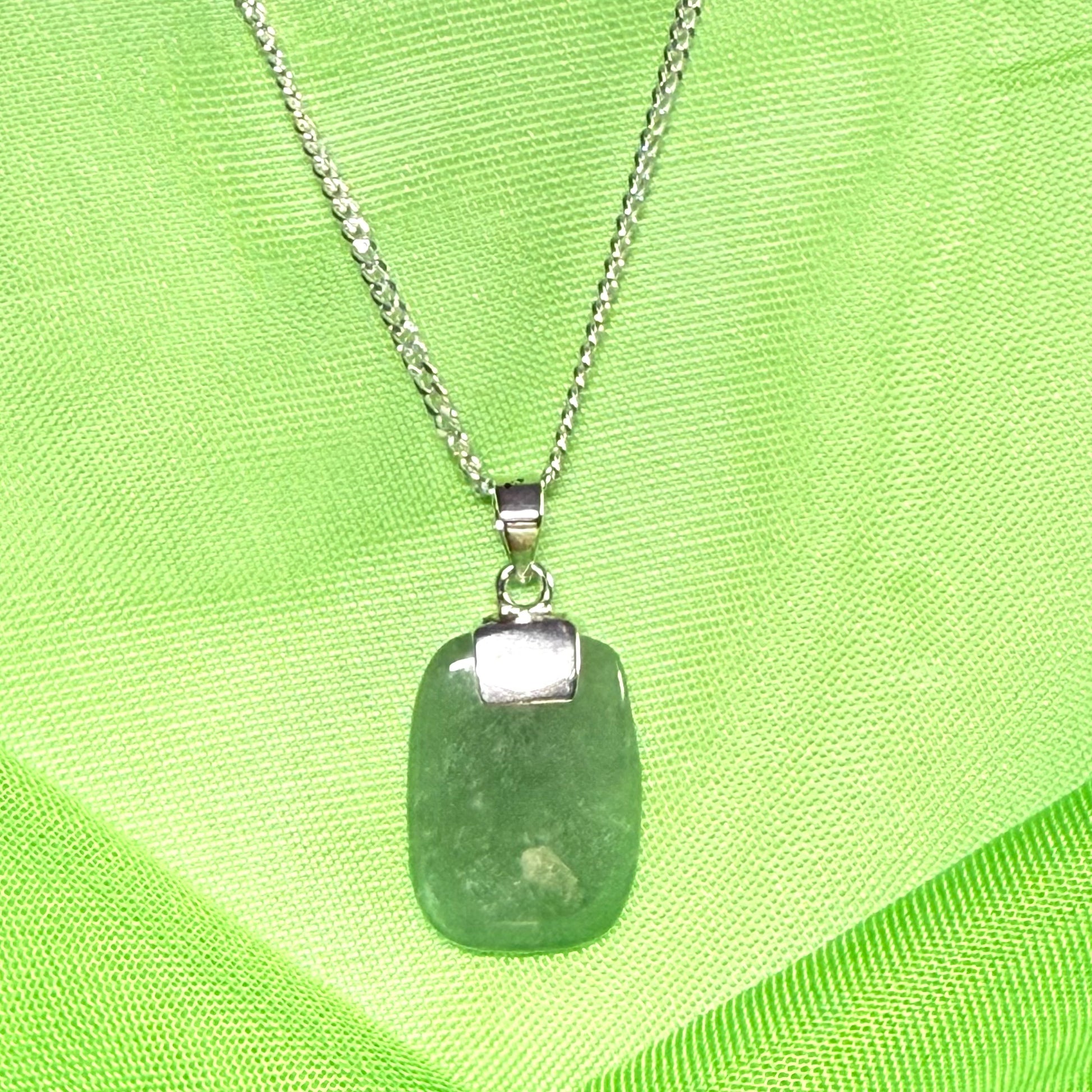 A cushion shaped silver real green jade necklace pendant