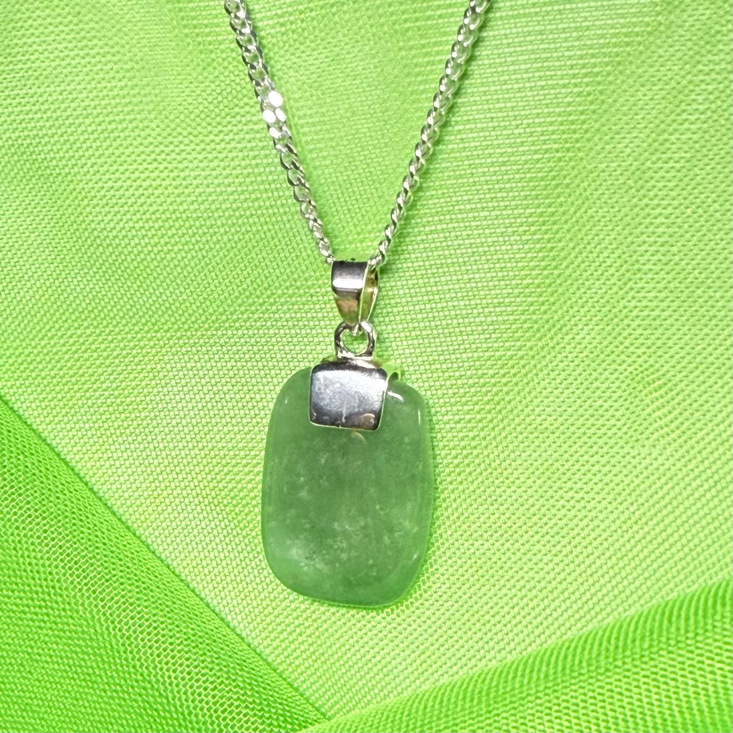 A cushion shaped silver real green jade necklace pendant