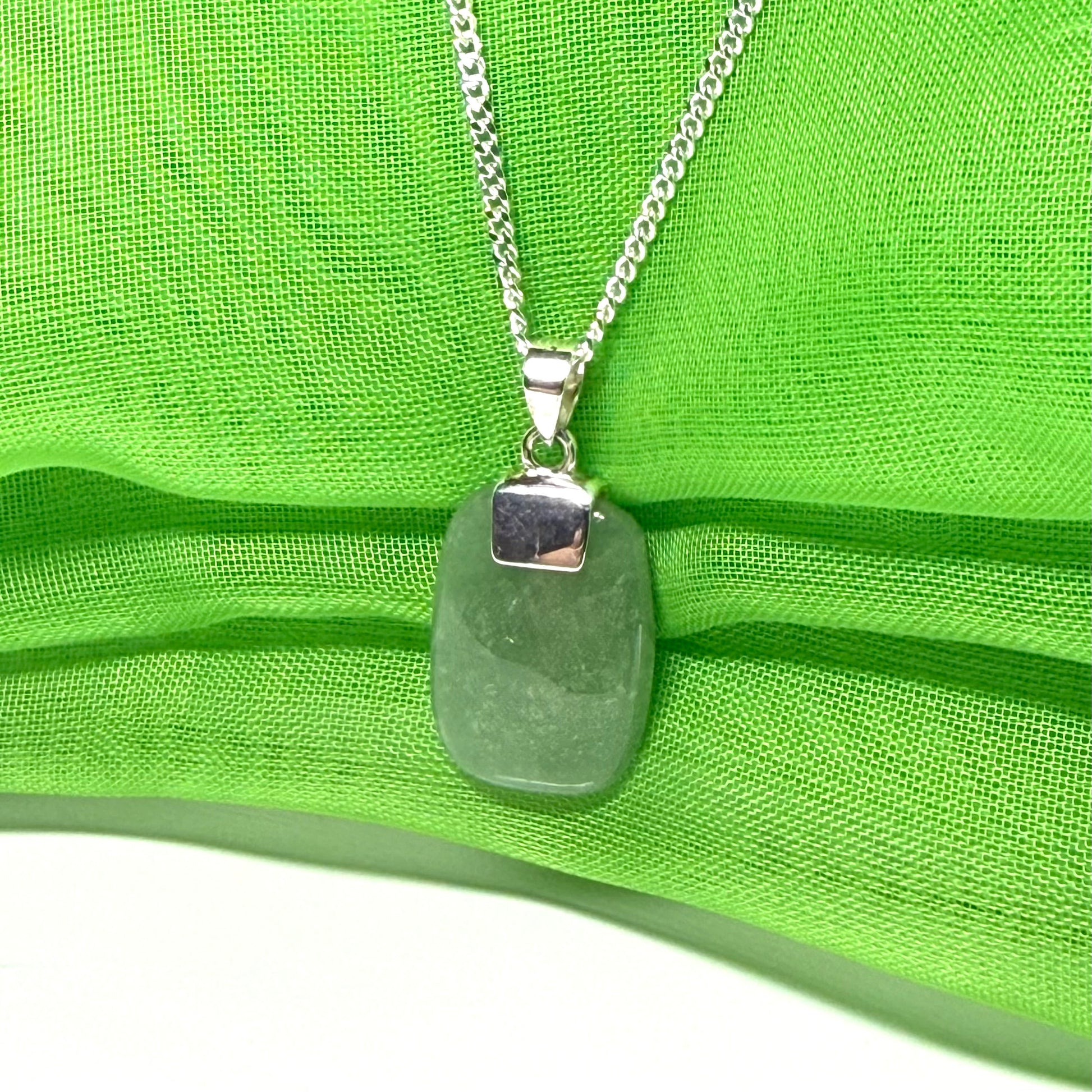 A cushion shaped silver real green jade necklace pendant