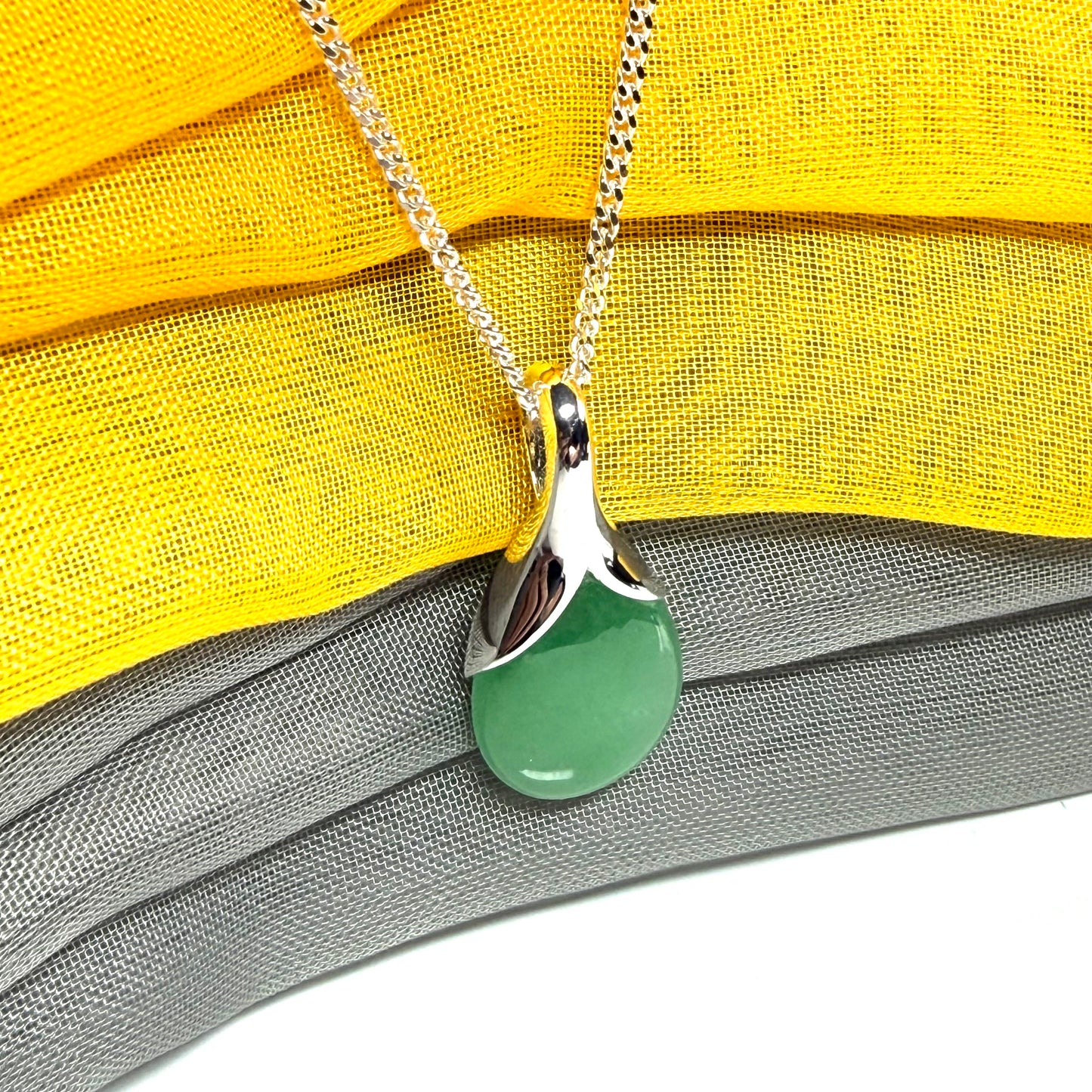A gorgeous real green jade pendant in a teardrop or pear shape, a really meaningful designed necklace