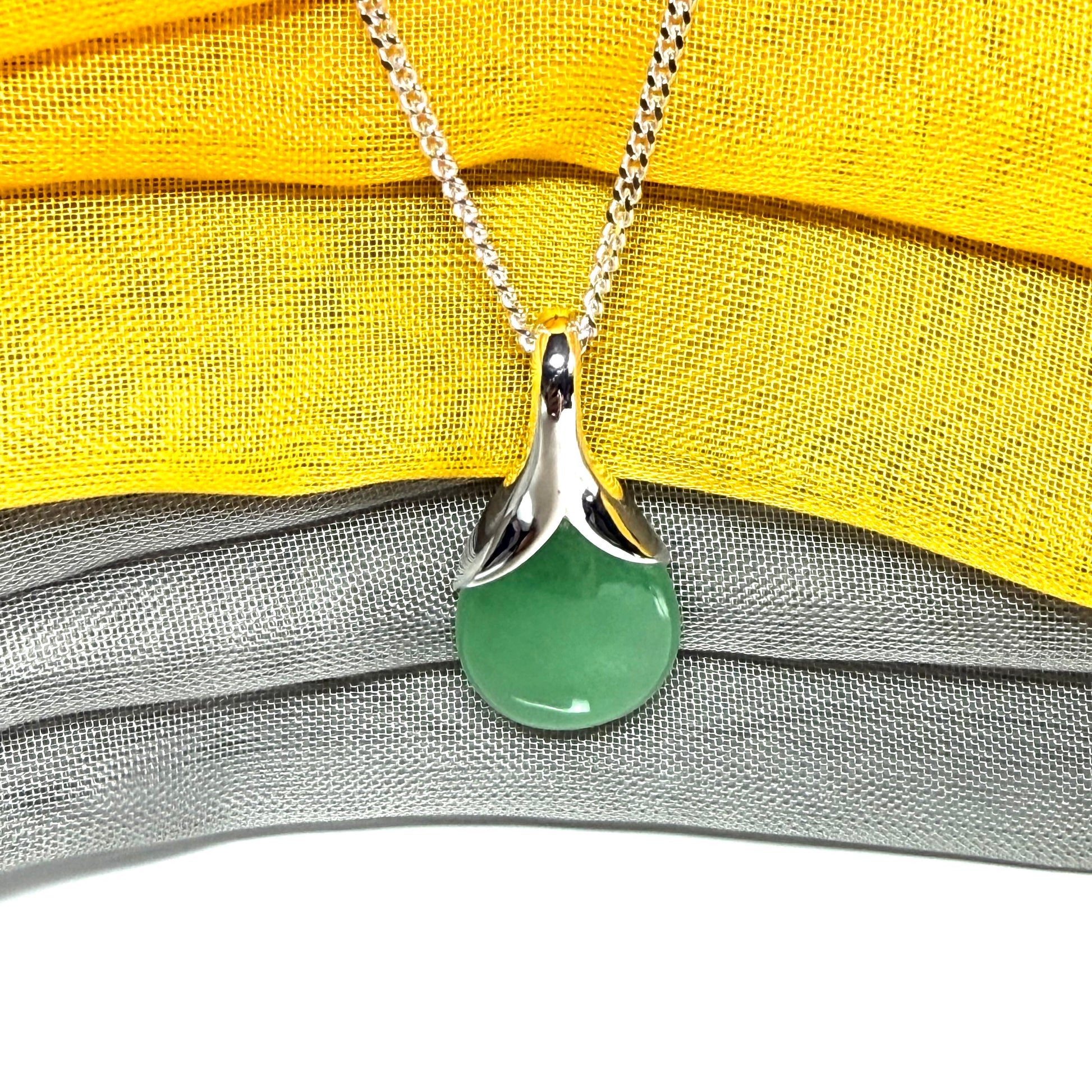 A gorgeous real green jade pendant in a teardrop or pear shape, a really meaningful designed necklace