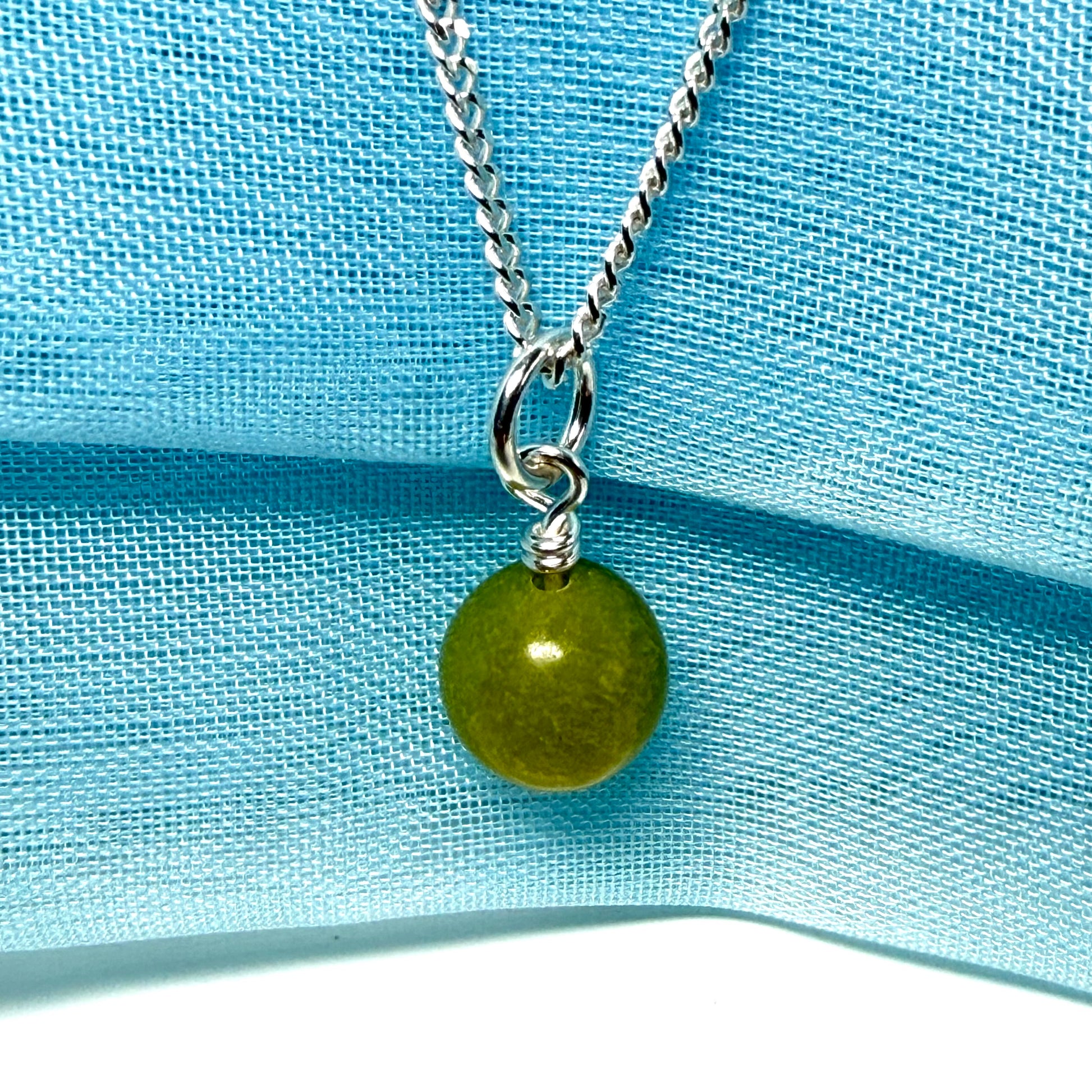 A gorgeous small real green gypsum necklace ball shaped, a really gorgeous round pendant with chain too