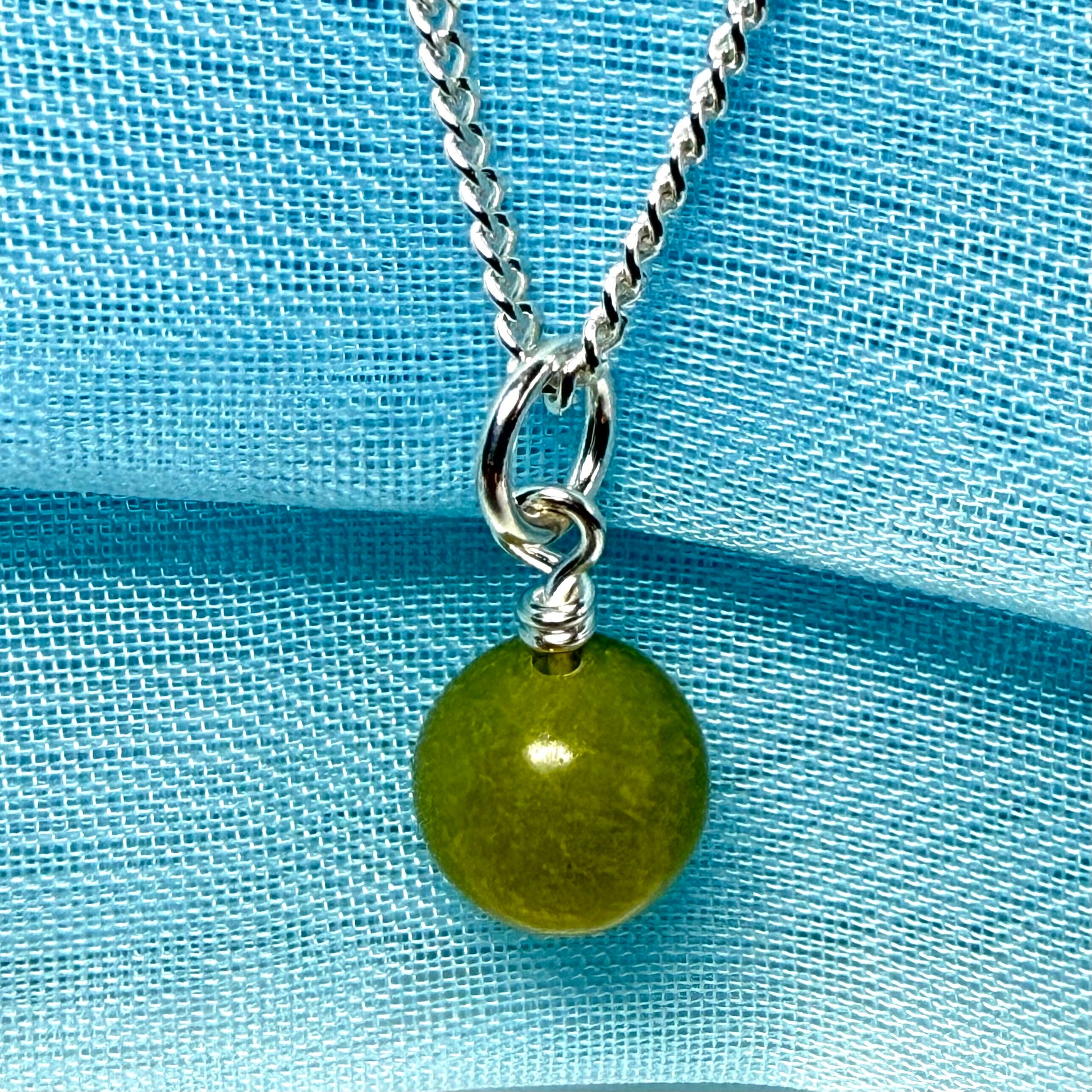 A gorgeous small real green gypsum necklace ball shaped, a really gorgeous round pendant with chain too