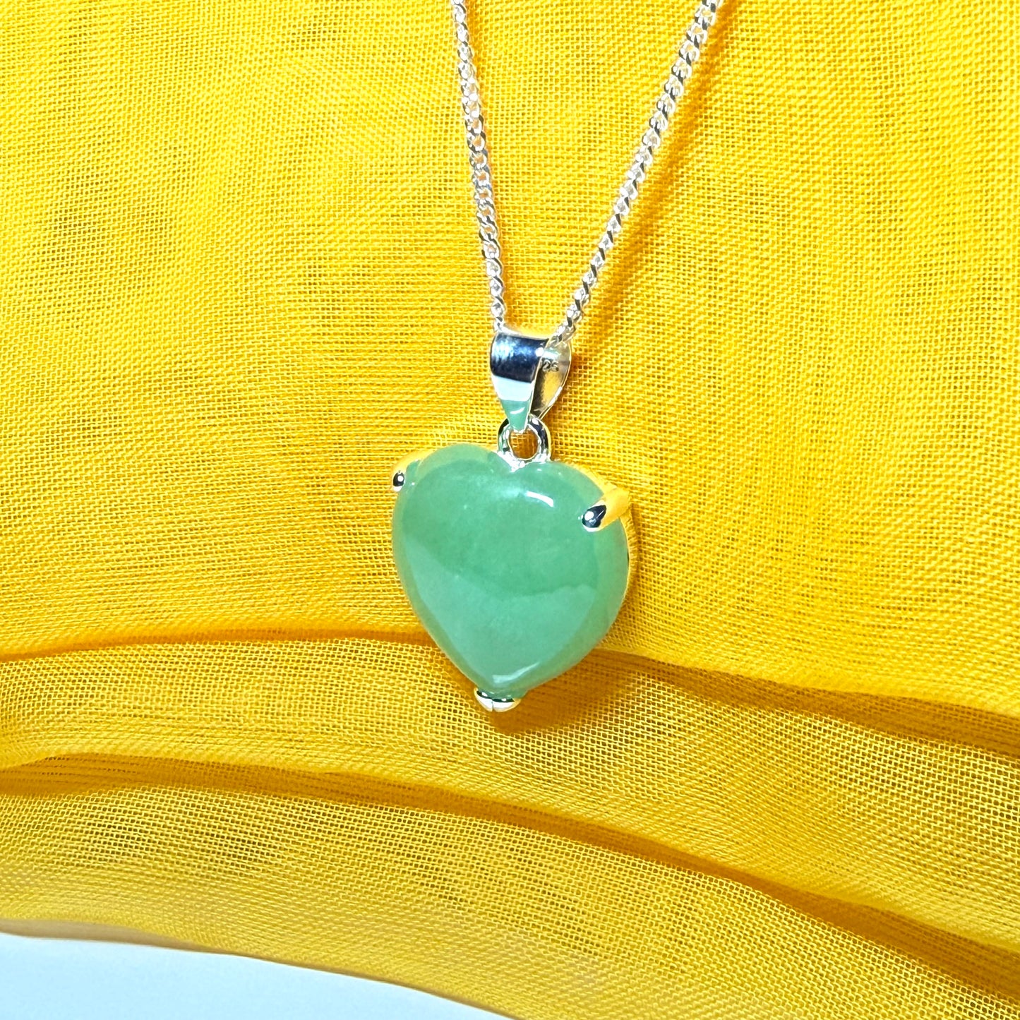 Heart shaped real green jade necklace with a claw set pendant and chain, simply gorgeous