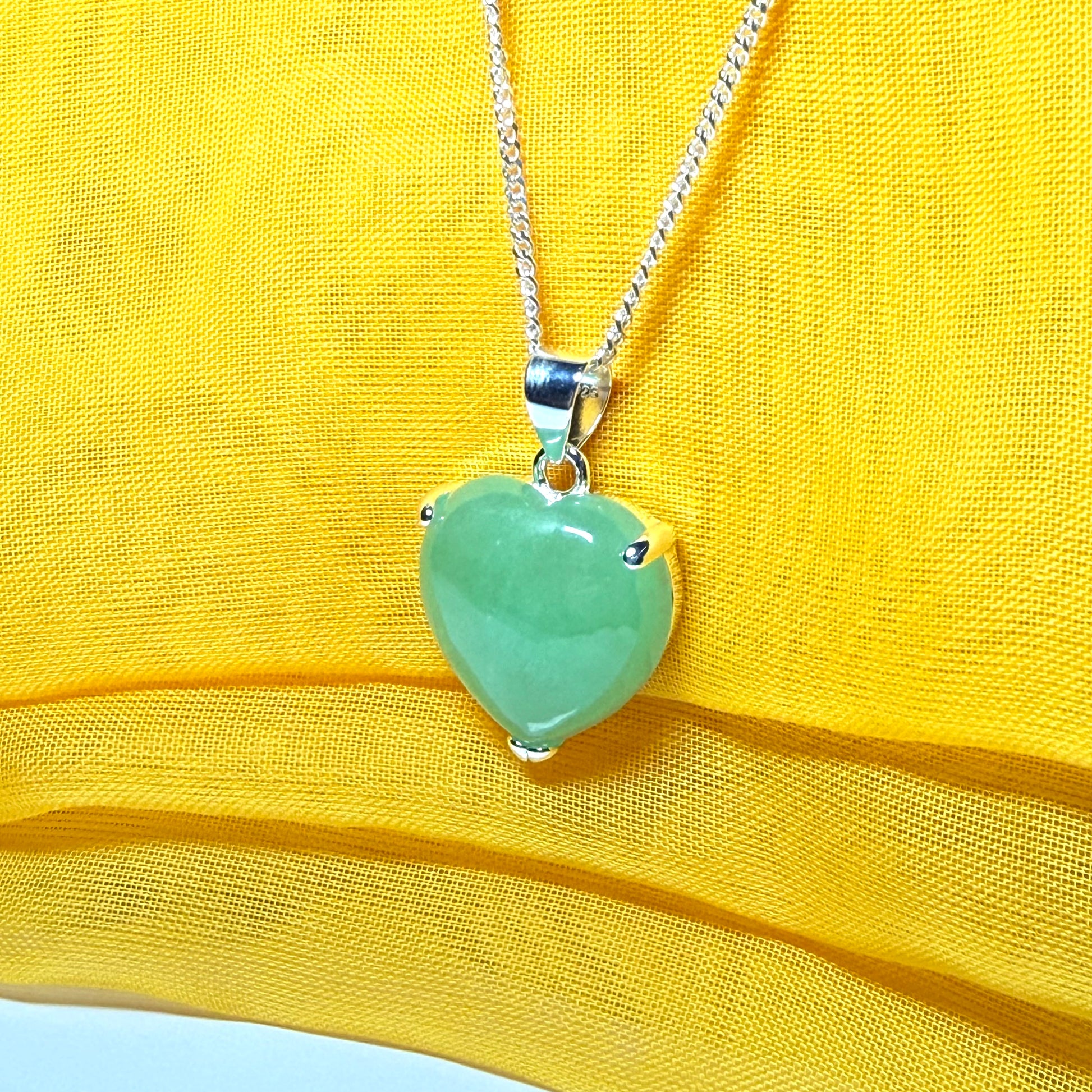 Heart shaped real green jade necklace with a claw set pendant and chain, simply gorgeous