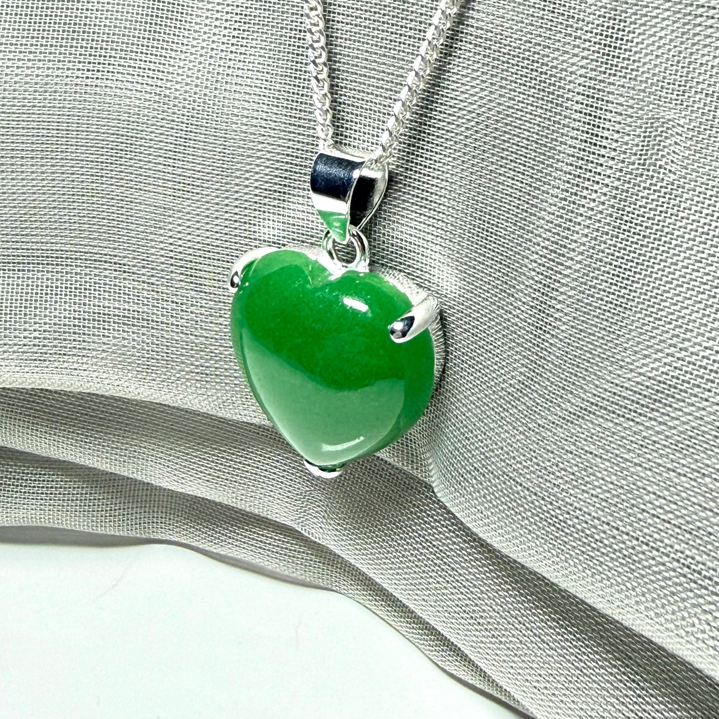Heart shaped real green jade necklace with a claw set pendant and chain