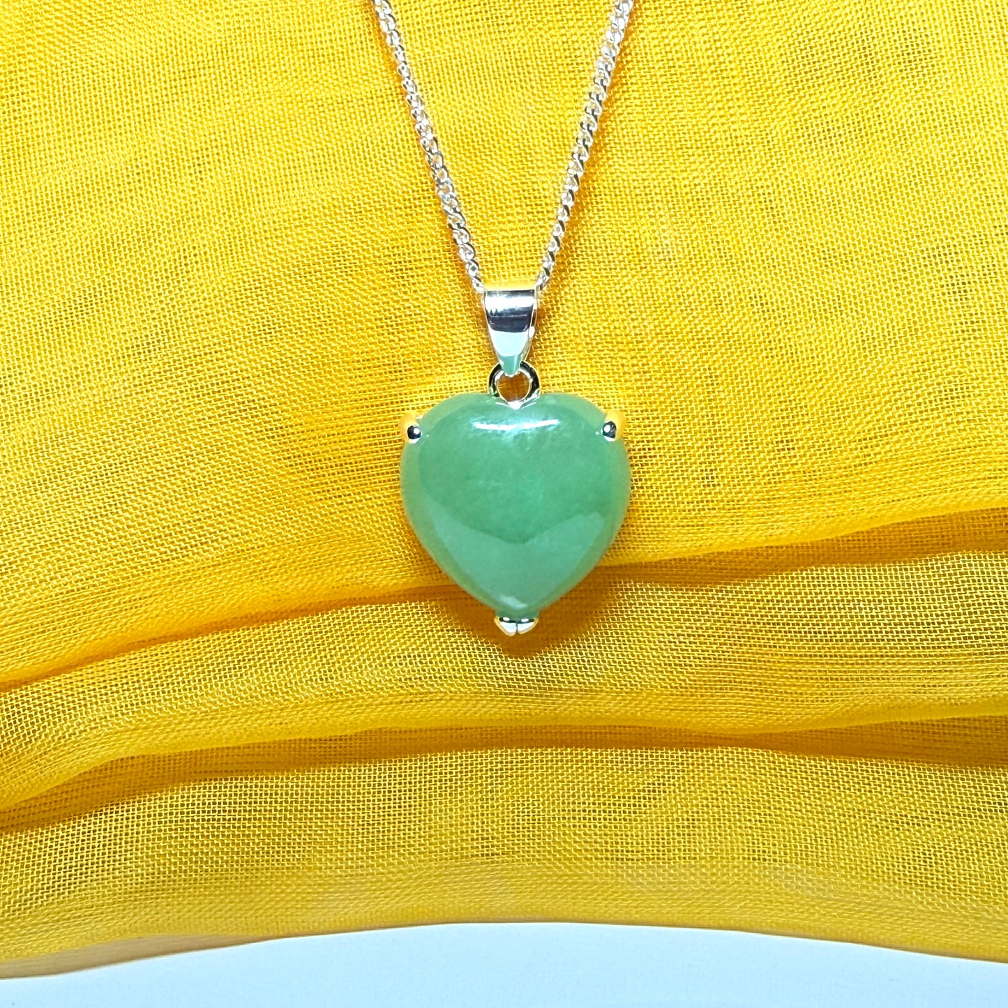 Heart shaped real green jade necklace with a claw set pendant and chain, simply gorgeous