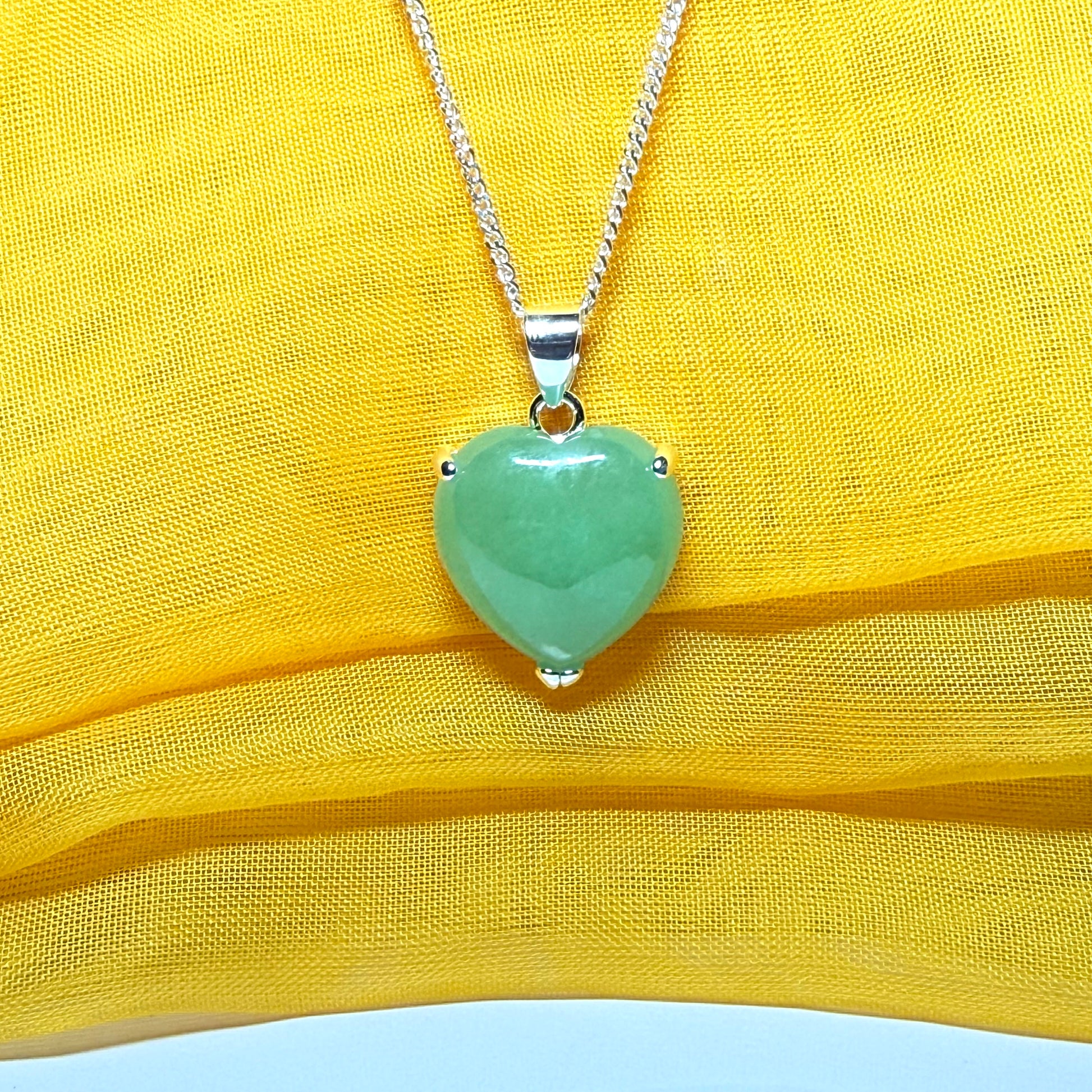 Heart shaped real green jade necklace with a claw set pendant and chain, simply gorgeous