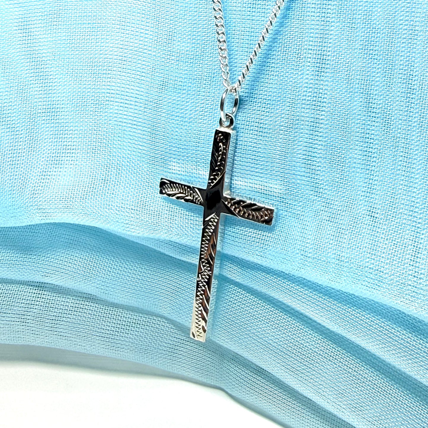 Large cross sterling silver with a patterned design