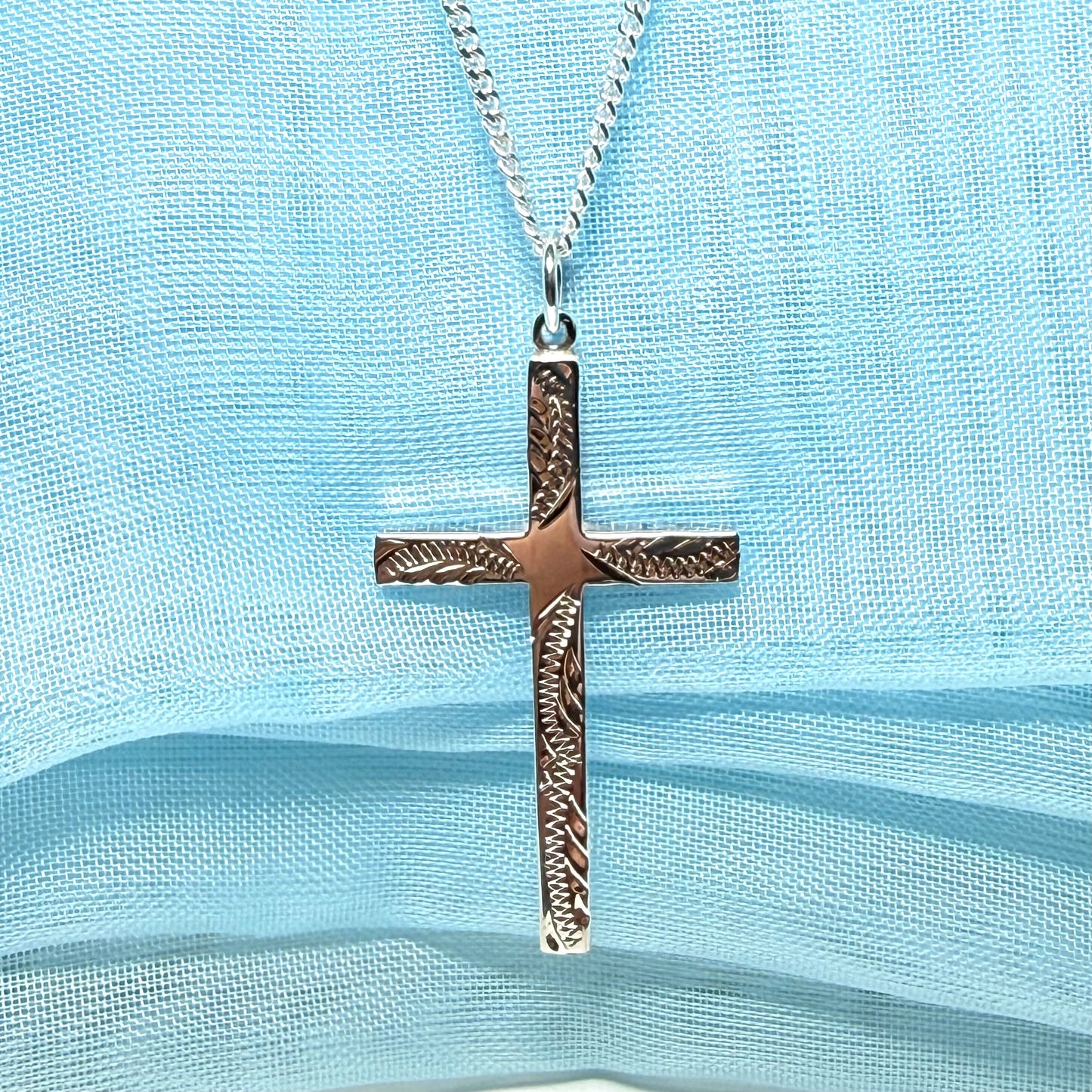 Large cross sterling silver with a patterned design