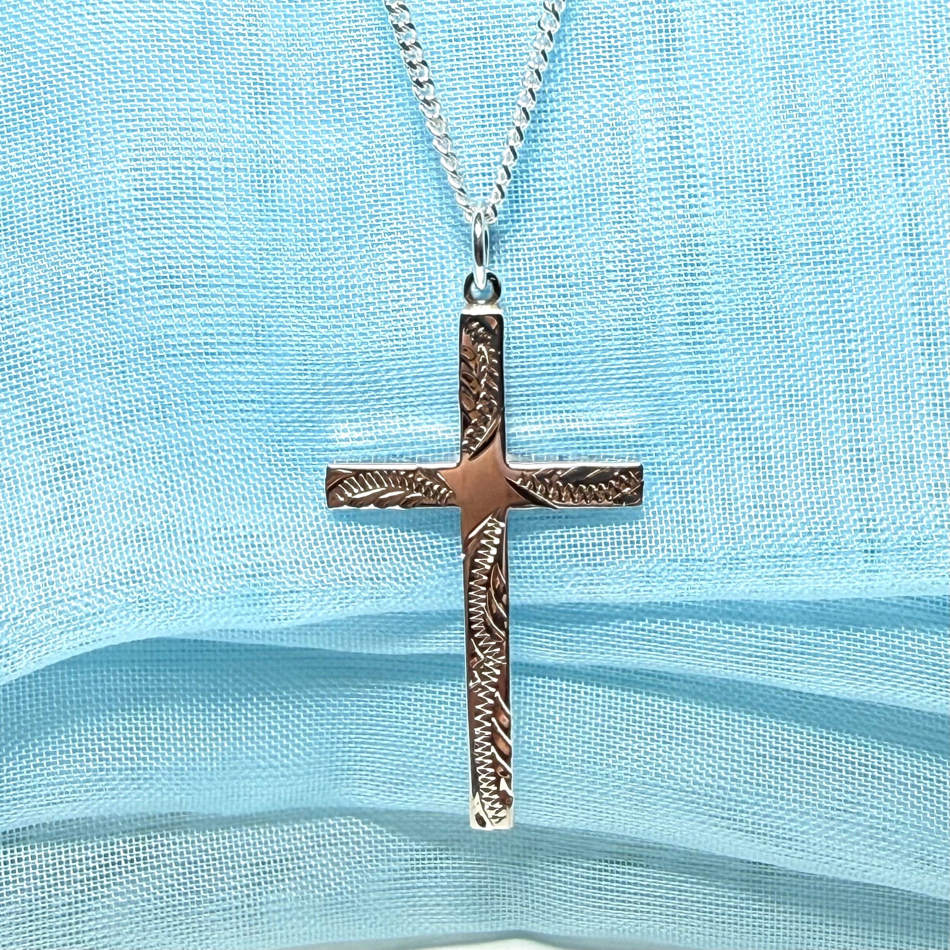 Large cross sterling silver with a patterned design