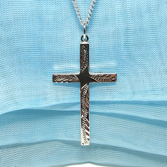 Large cross sterling silver with a patterned design