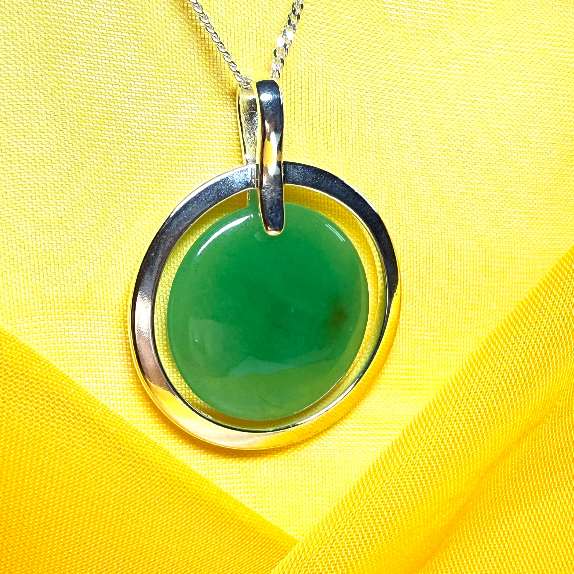 A large round halo necklace sterling silver circle shaped green real jade