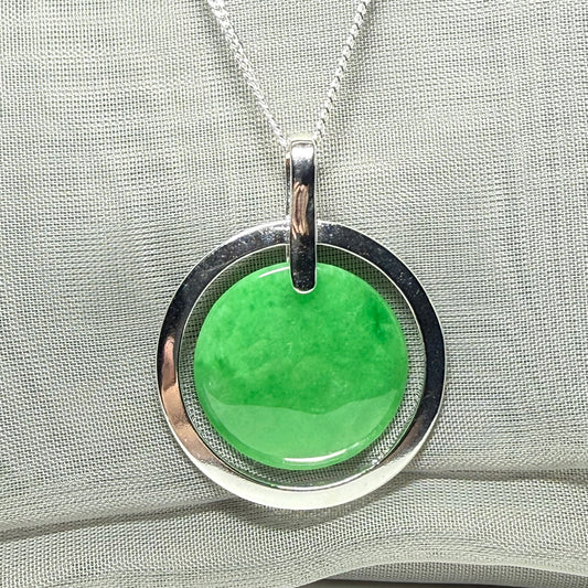 A large sterling silver green real jade necklace halo style, a gorgeous designed round pendant