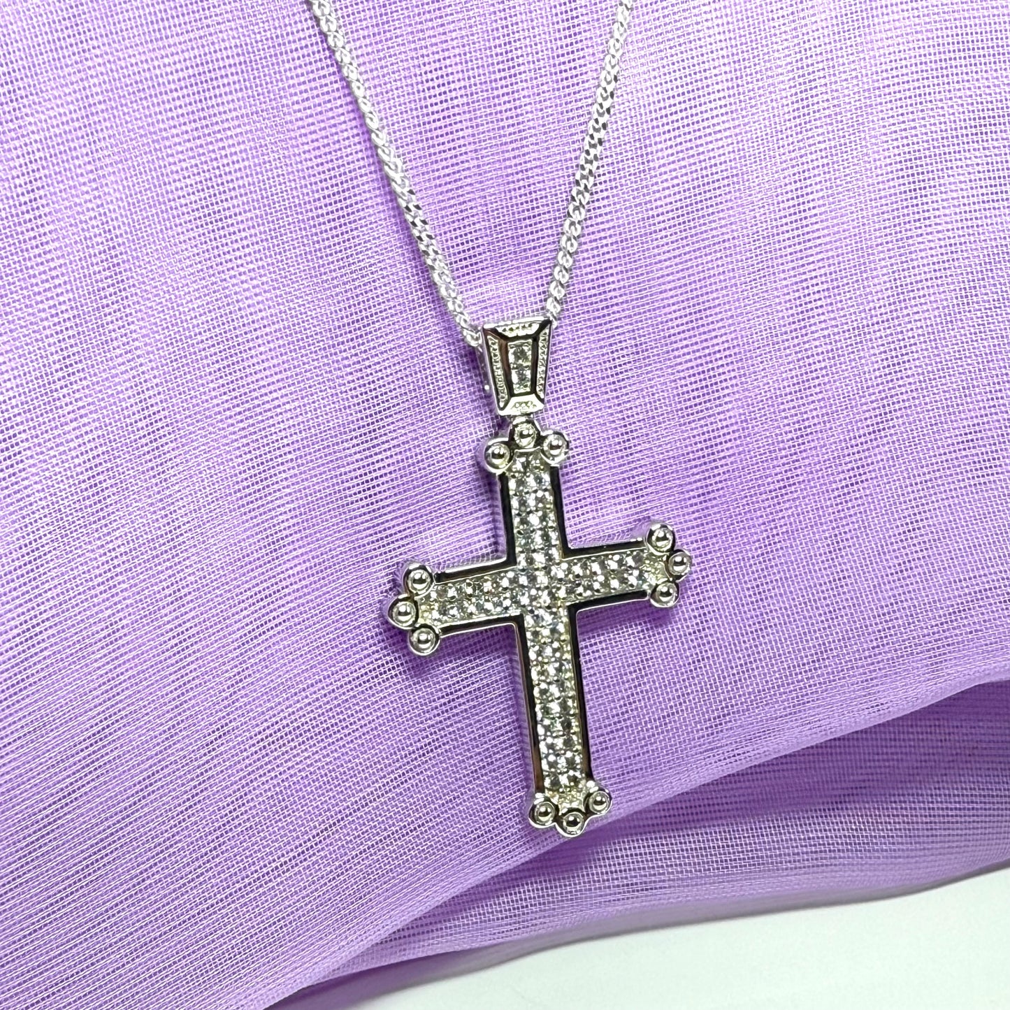 A large stone set cross sterling silver cubic zirconia fancy including chain