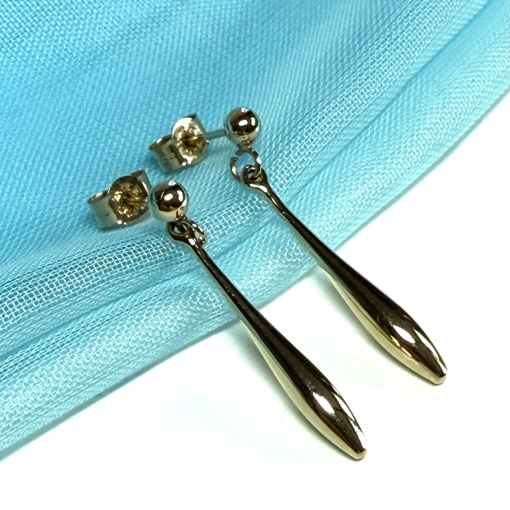 Sharp bomber shaped long teardrop gold drop earrings