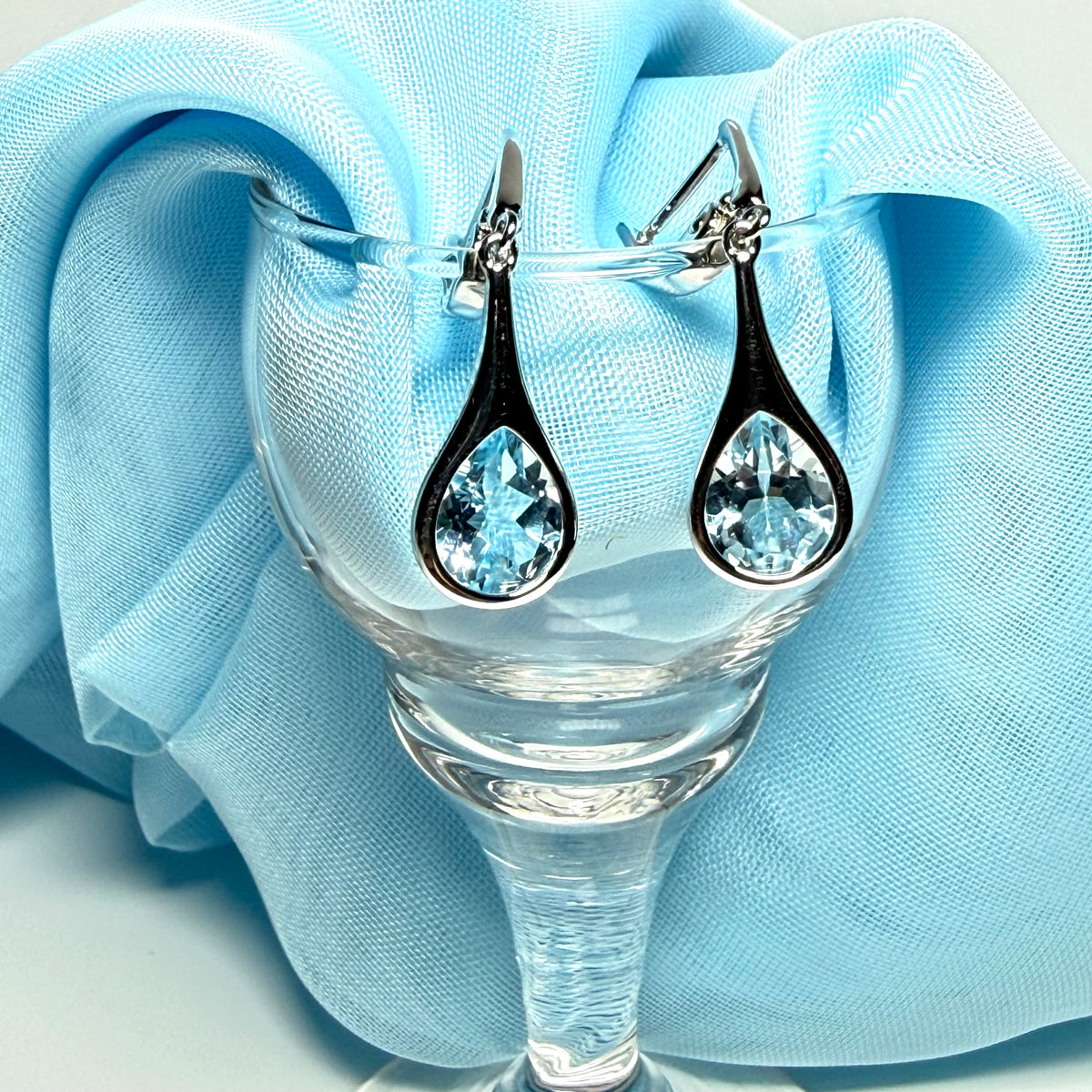 Real blue topaz sterling silver dropped earrings pear shaped stones