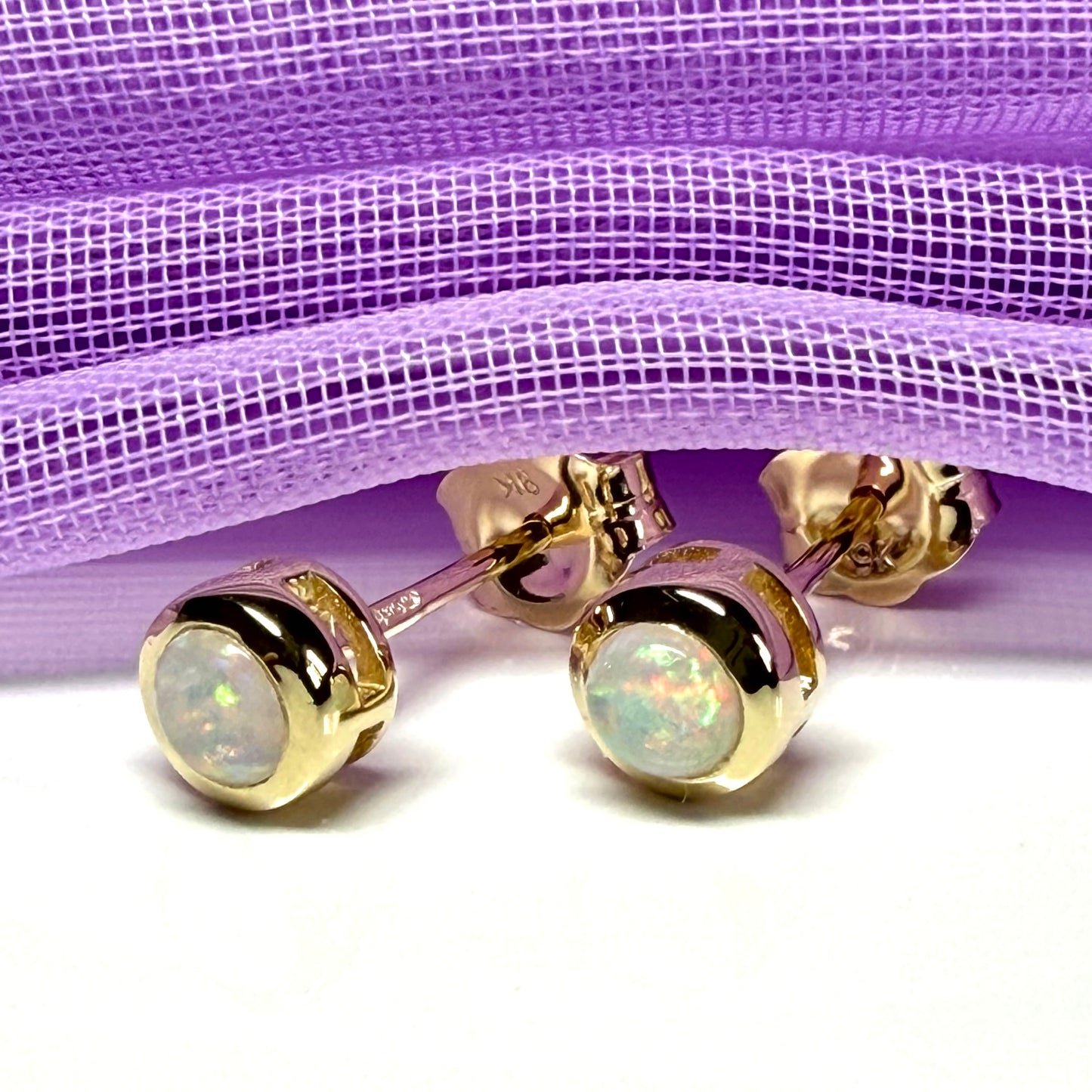 Pair of real opal earrings round yellow gold stud smooth rubbed over setting