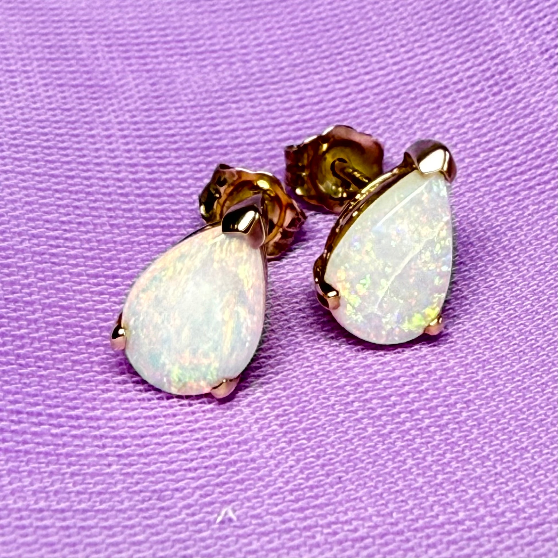 Real opal stud earrings Yellow gold claw setting with teardrop stones