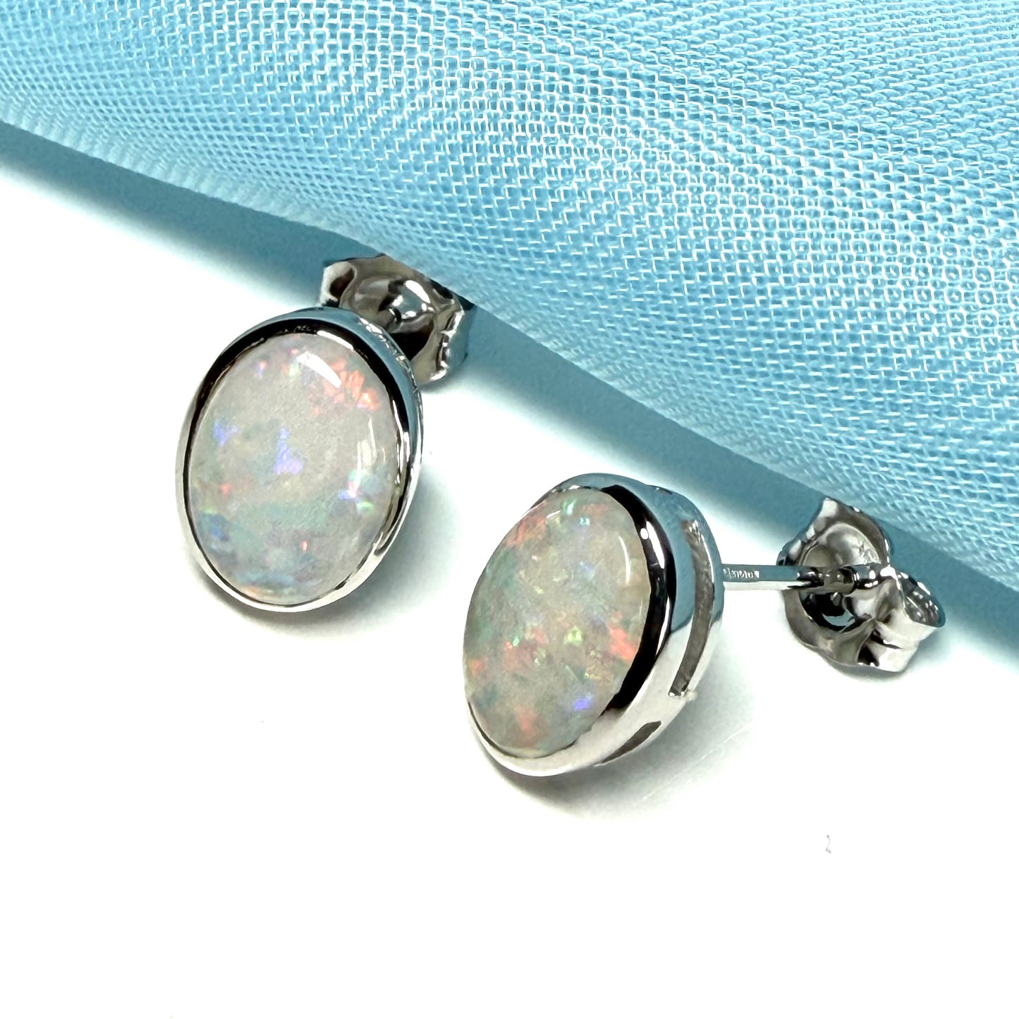 Pair of real opal white gold oval stud earrings
