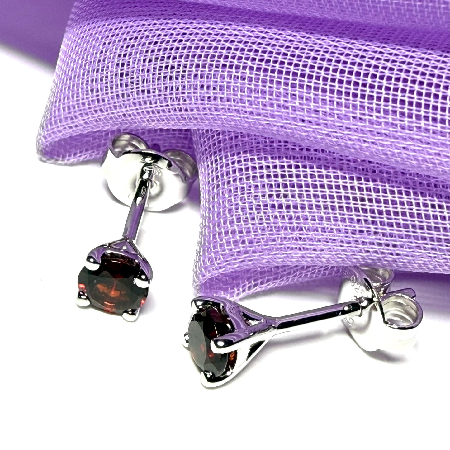 Pair of real red garnet silver round four claw stud earrings