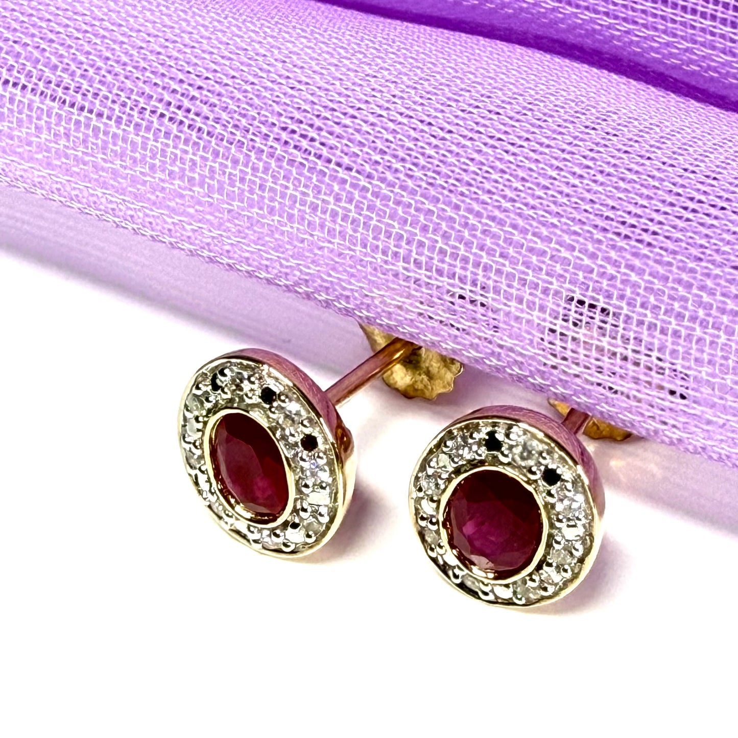 Real ruby and diamond oval shaped cluster stud earrings yellow gold