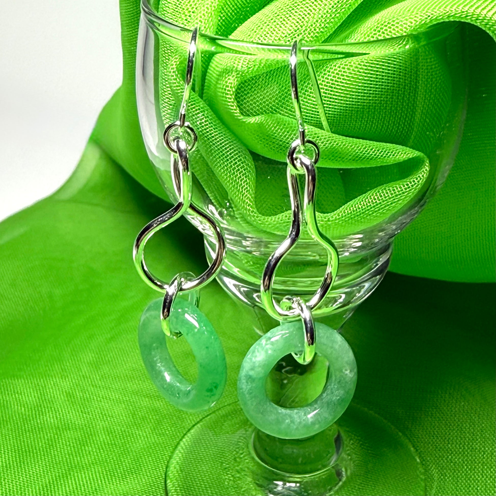 A rounded shaped real green jade sterling silver dangling dropped earrings