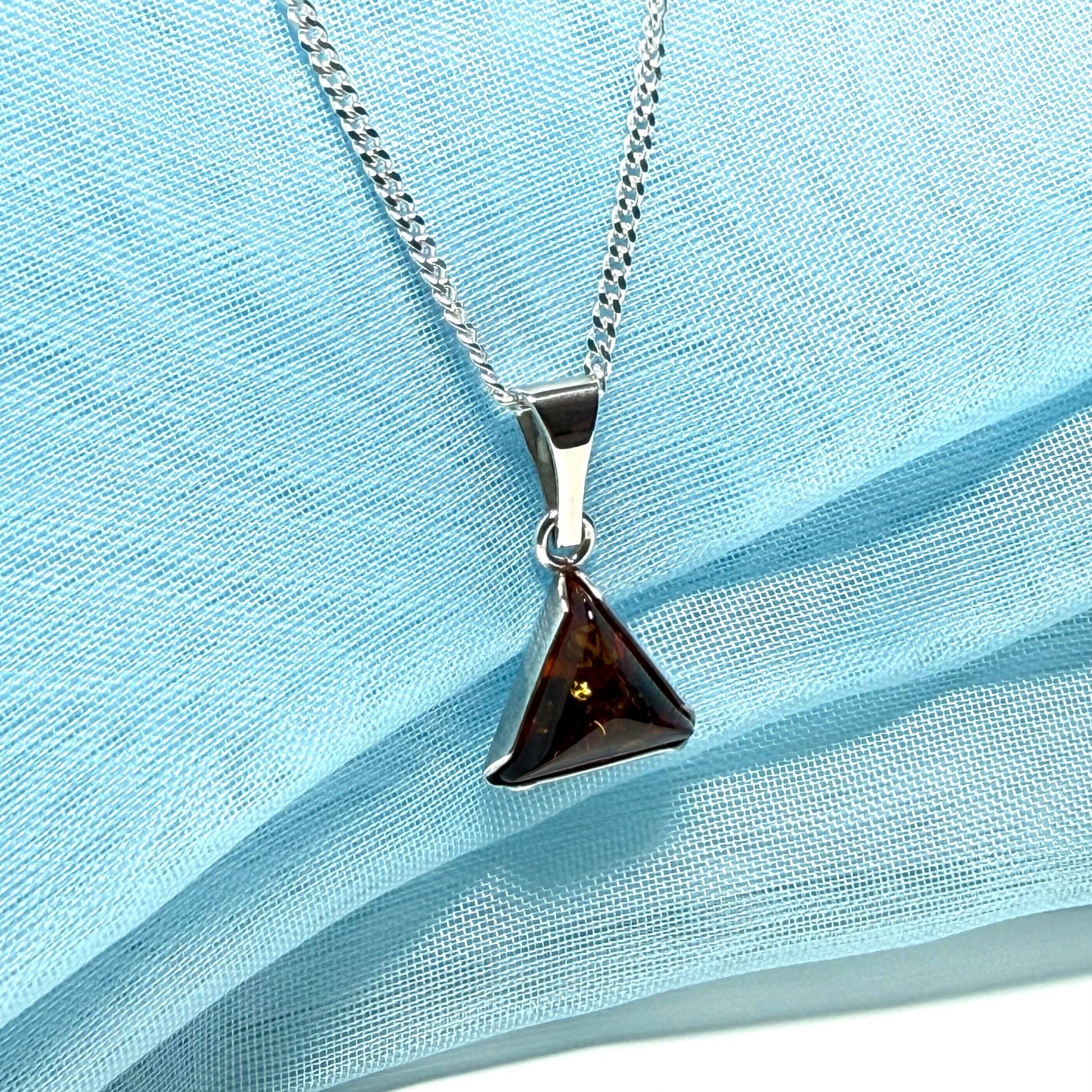 A real amber necklace sterling silver triangle shape dark amber pendant