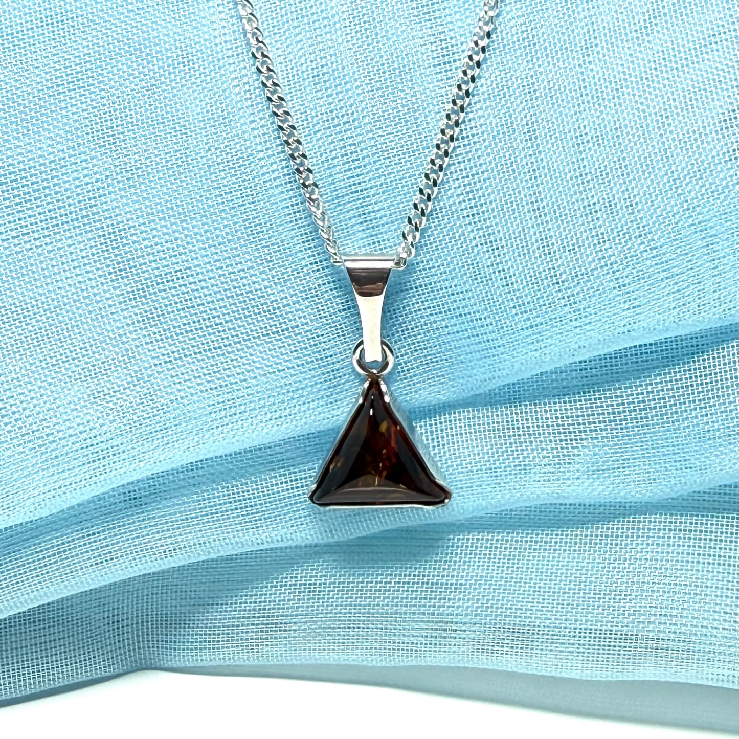 A real amber necklace sterling silver triangle shape dark amber pendant