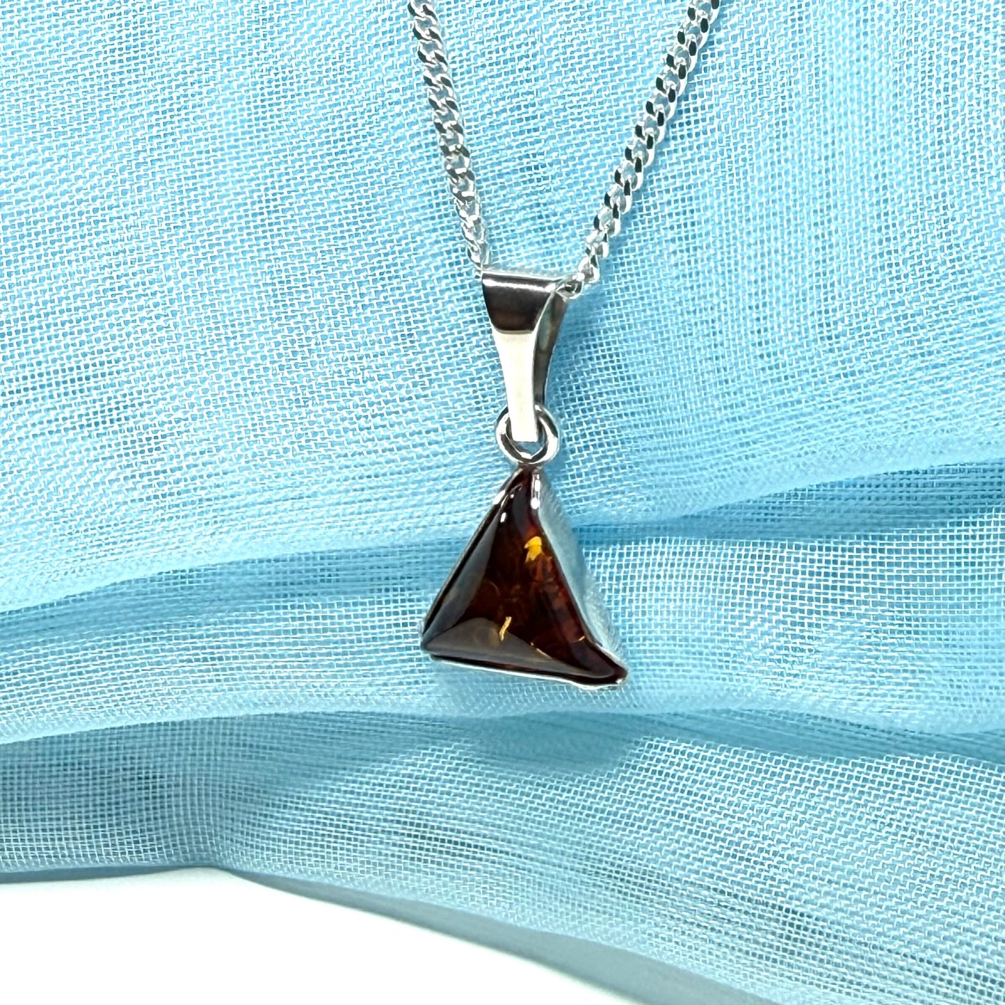 A real amber necklace sterling silver triangle shape dark amber pendant