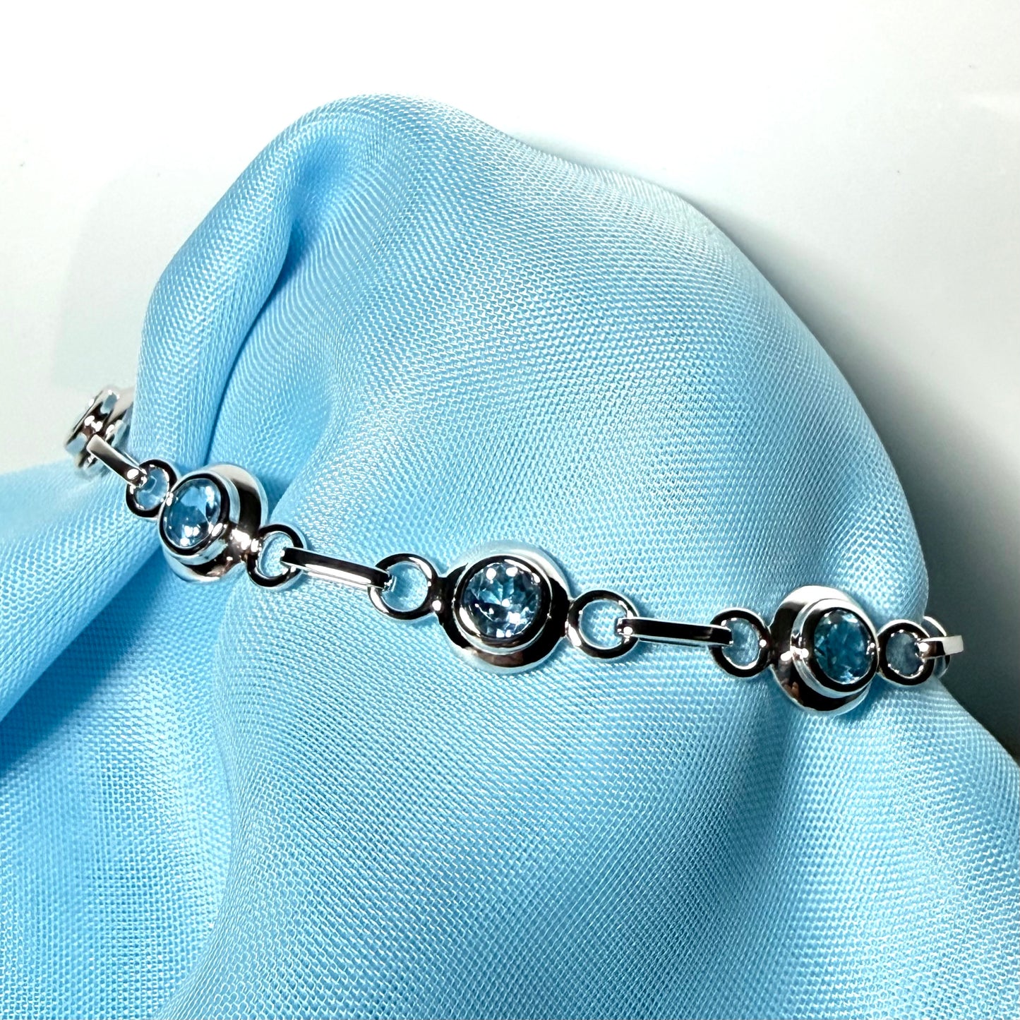 Real blue topaz fancy round link sterling silver bracelet