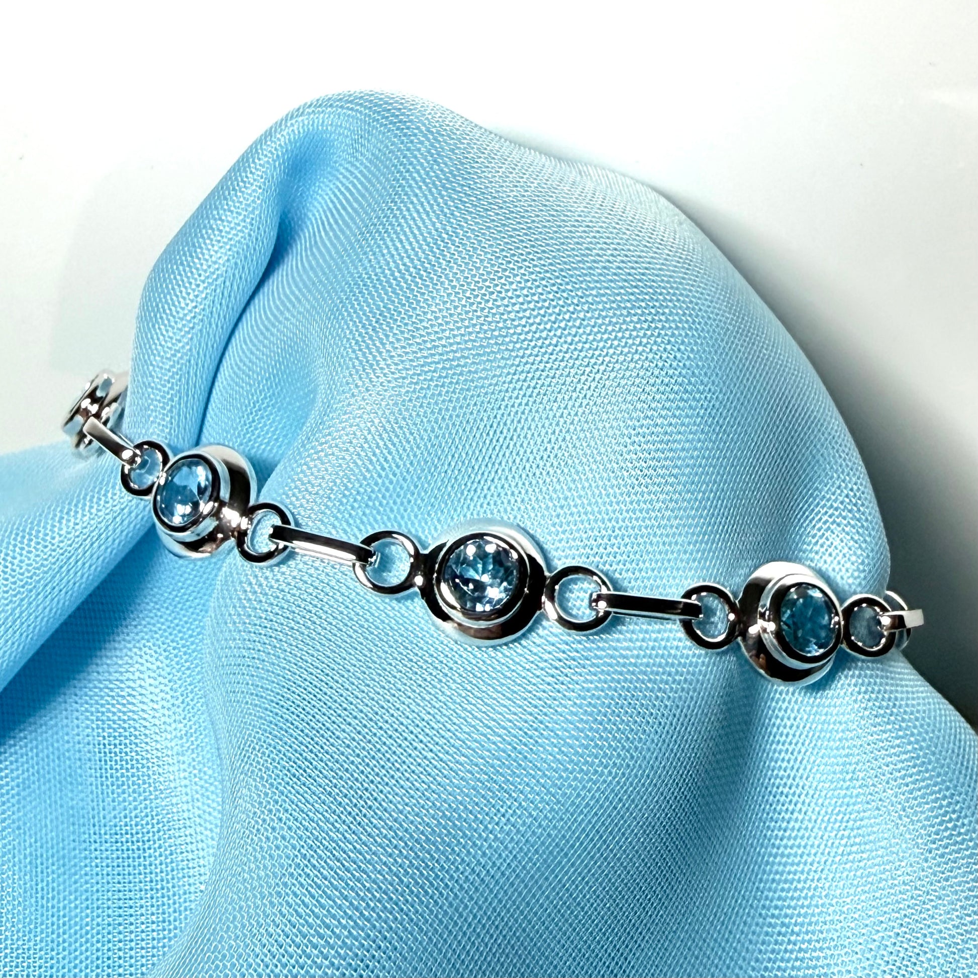 Real blue topaz fancy round link sterling silver bracelet