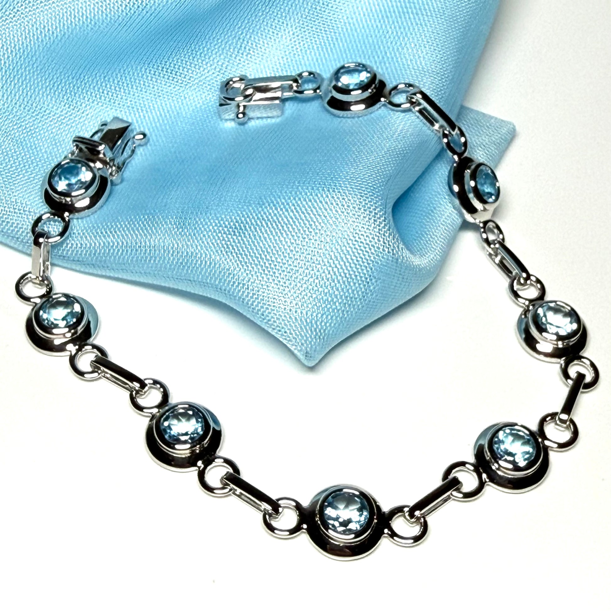Real blue topaz fancy round link sterling silver bracelet